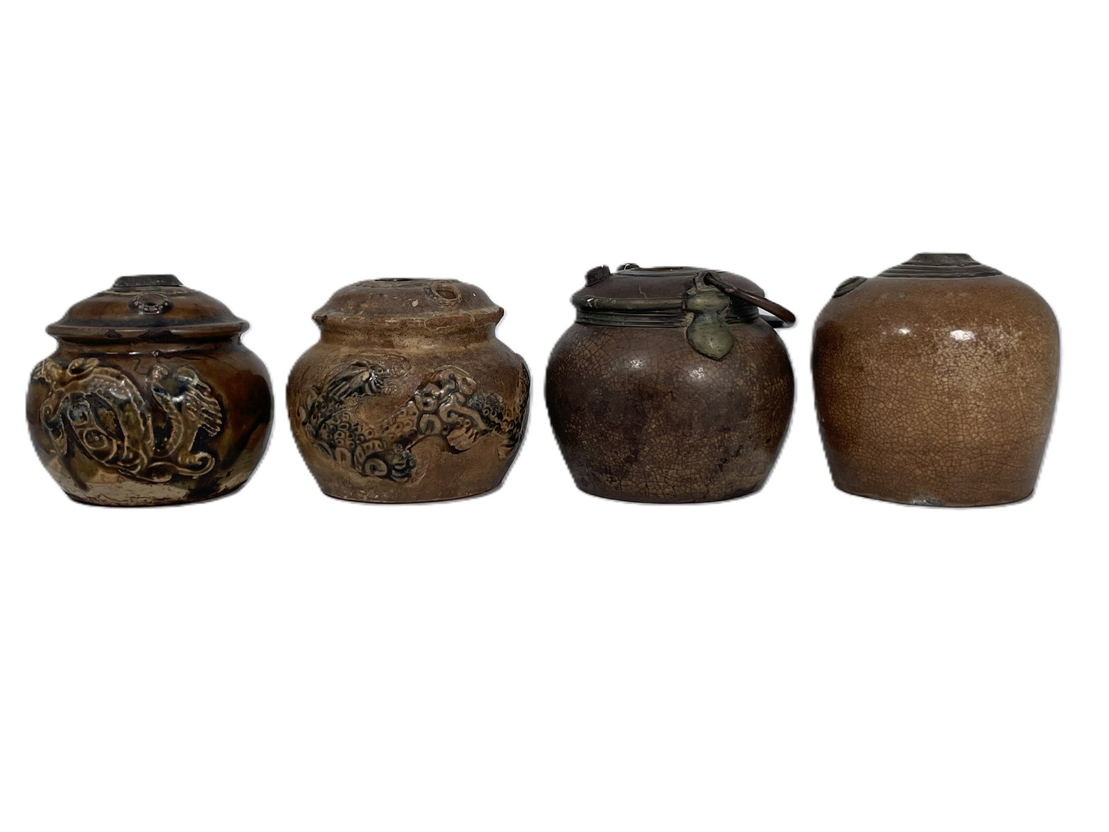 A Group of Four Vietnamese Jar-Shaped Water Pipes: The one with no decoration or handle measures 4 in. high, 4 in. wide; the one with handle measures 3.3/4 in. high, 4.1/4 in. wide; the larger 'dragon and cloud' one measures 3.3/4 in. high, 4.1/4 in. 