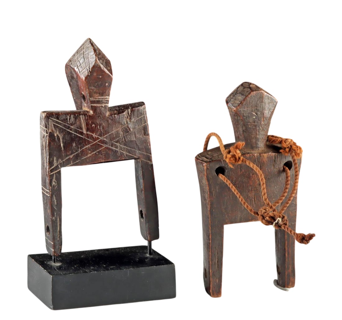 Two African Senufo Carved Wood Heddle Weaving Pulleys, Late 19th to Early 20th century: West Africa, Burkina Faso or Cote d?Ivoire, Senufo culture, circa late 19th to early 20th century. A pair of carved wooden heddle pulleys, each decorated with incised linear motifs. The larger example