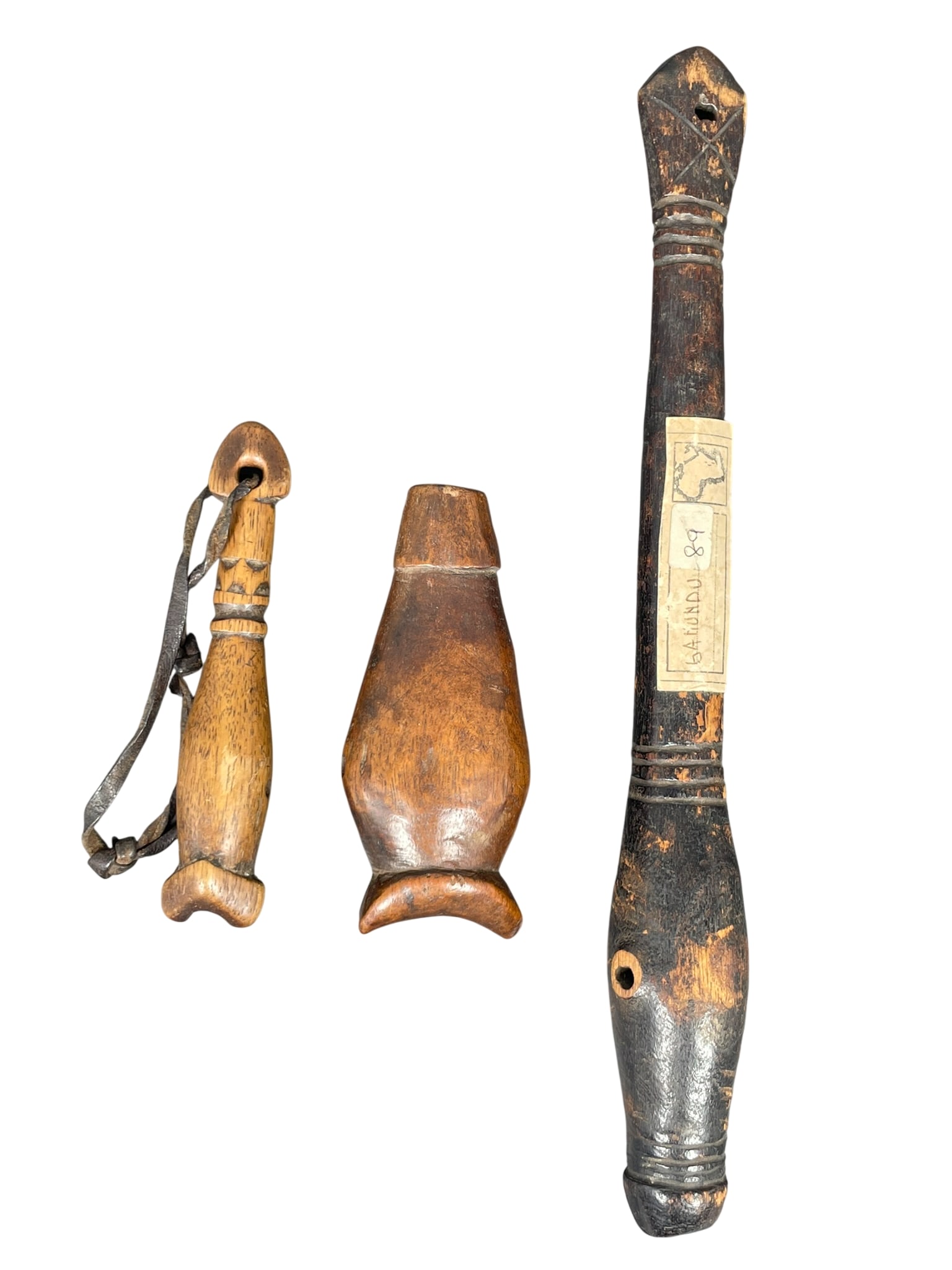 Three African Burkina Faso Wood Hunting Whistles: The longest measures 11 in. long, 1.1/2 in. wide. From the Collection of a Private Long Island Collector.