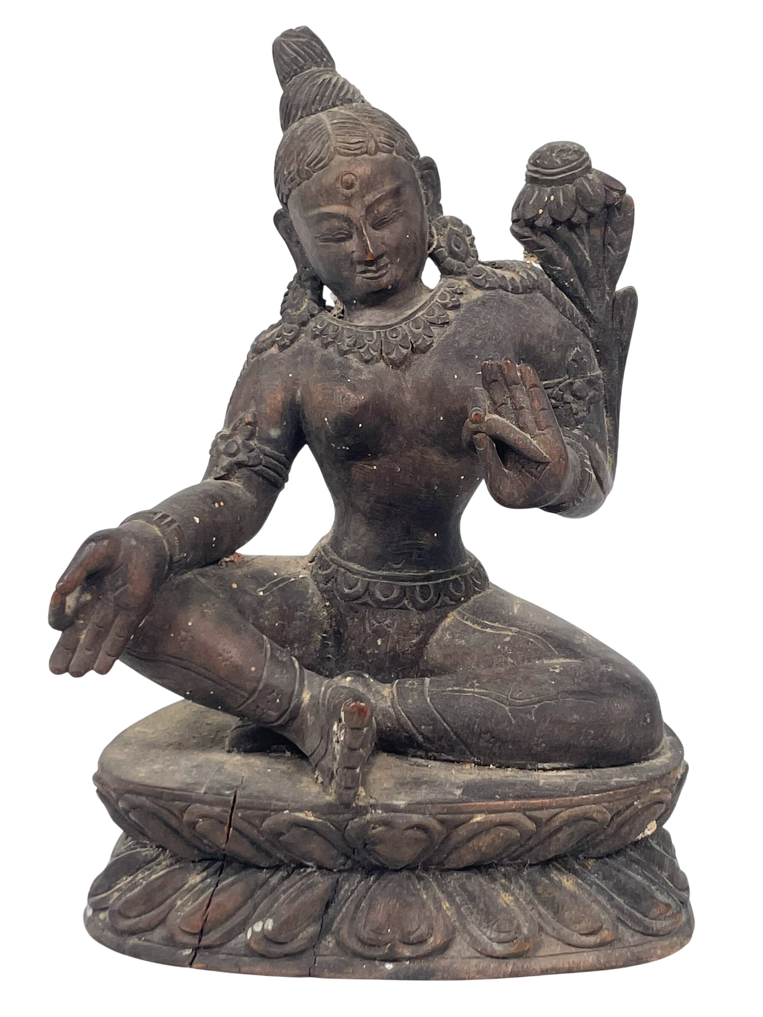 A Nepalese Carved Wood Figure of Green Tara: 6.3/8 in. high, 5 in. wide.