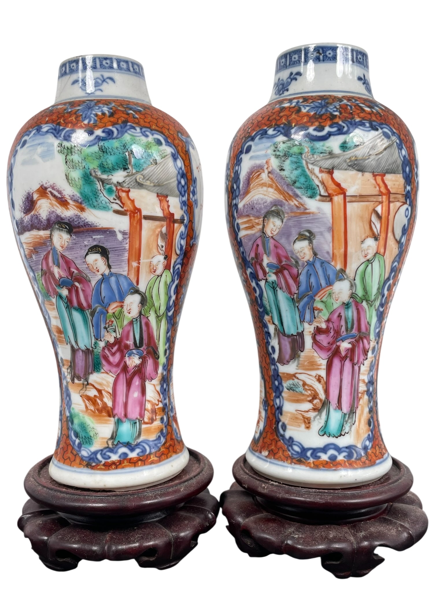 A Pair of Chinese Export Famille Rose 'Medallion' 'Figural' Porcelain Vases, 18th Century, Qianlong: Both with wood stand. The vases measures 7.1/2 in. high, 3.3/8 in. wide each.