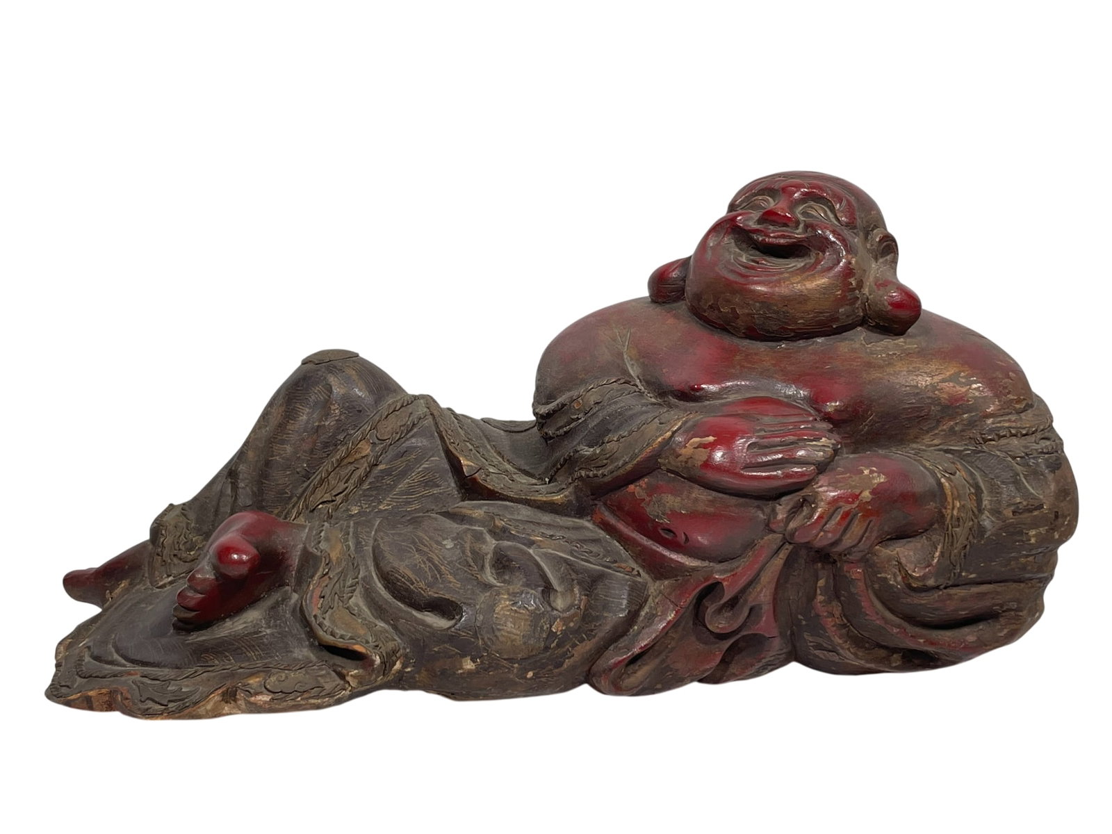A Chinese Wood Lacquer Buddha: 12 in. high, 23 in. wide.