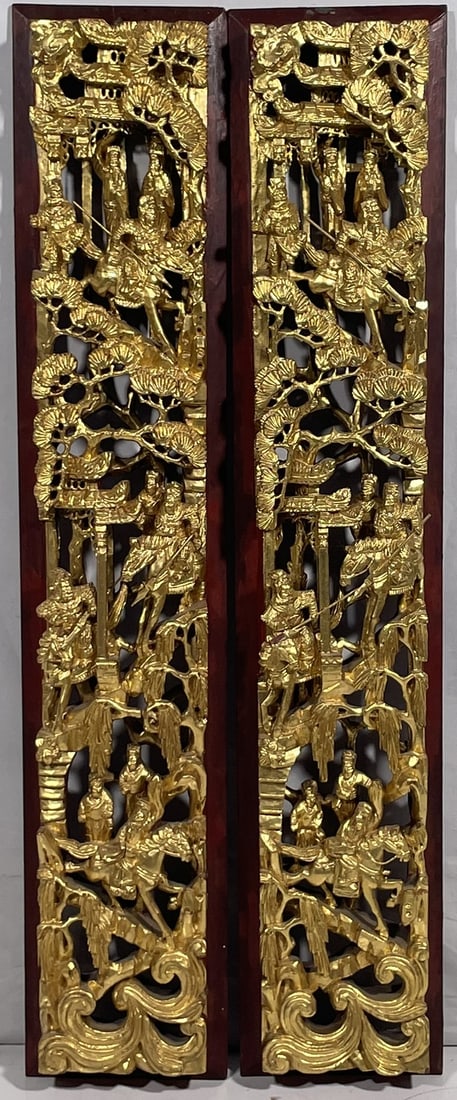 A Pair of Chinese Carved Gilt-Wood 'Warriors' Panels: 31.1/4 in. high, 6.1/4 in. wide, 2.1/2 in. thick each.