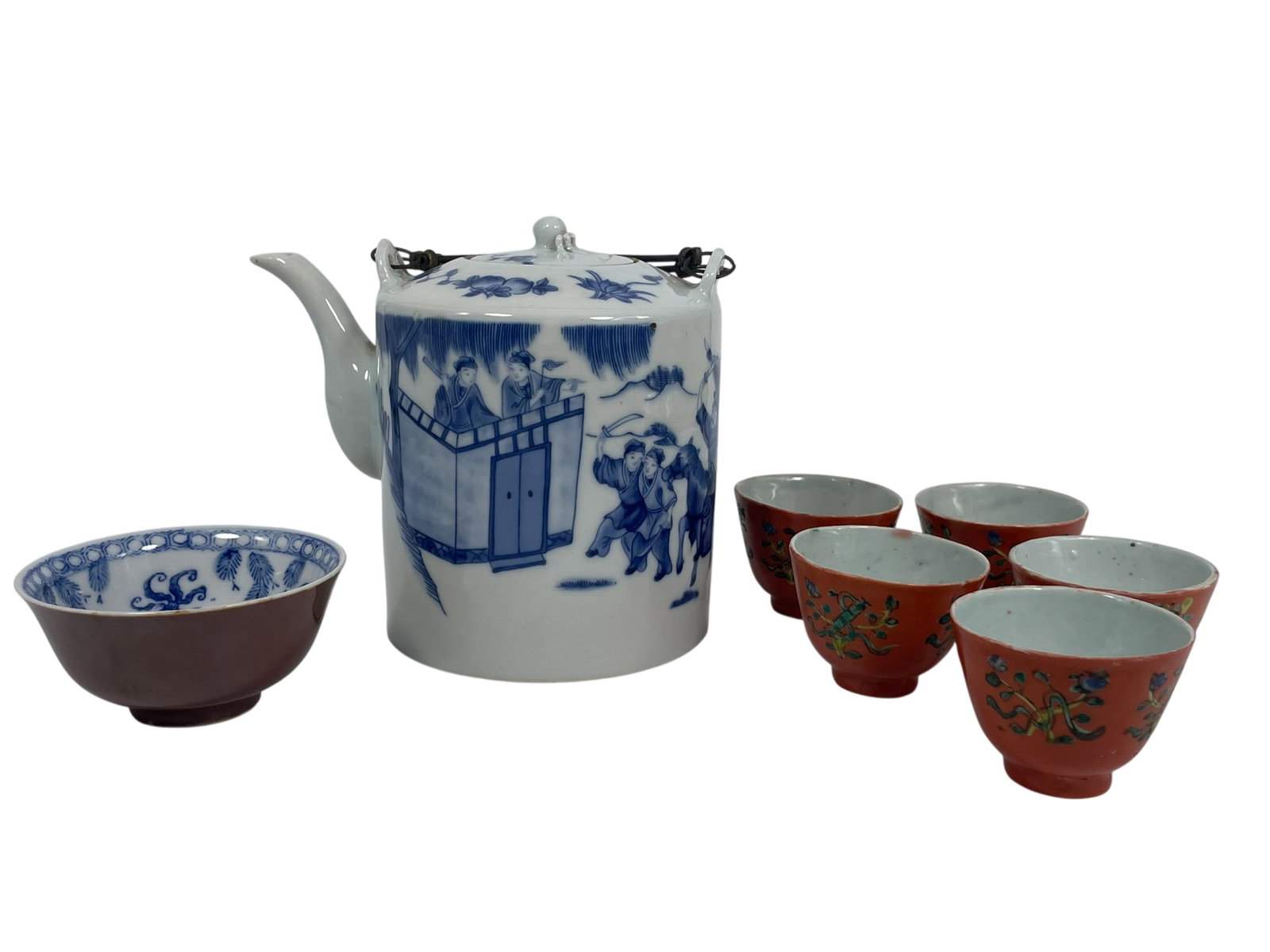 A Group of Seven Chinese Porcelain Ware: Comprising a blue and white teapot and cover, 6 in. high, 7 in. wide; a underglaze-blue decorated cafe-au-lait-glazed bowl, 1.7/8 in. high,l 3.7/8 in. diam.; and a set of five famille rose coral-red-g