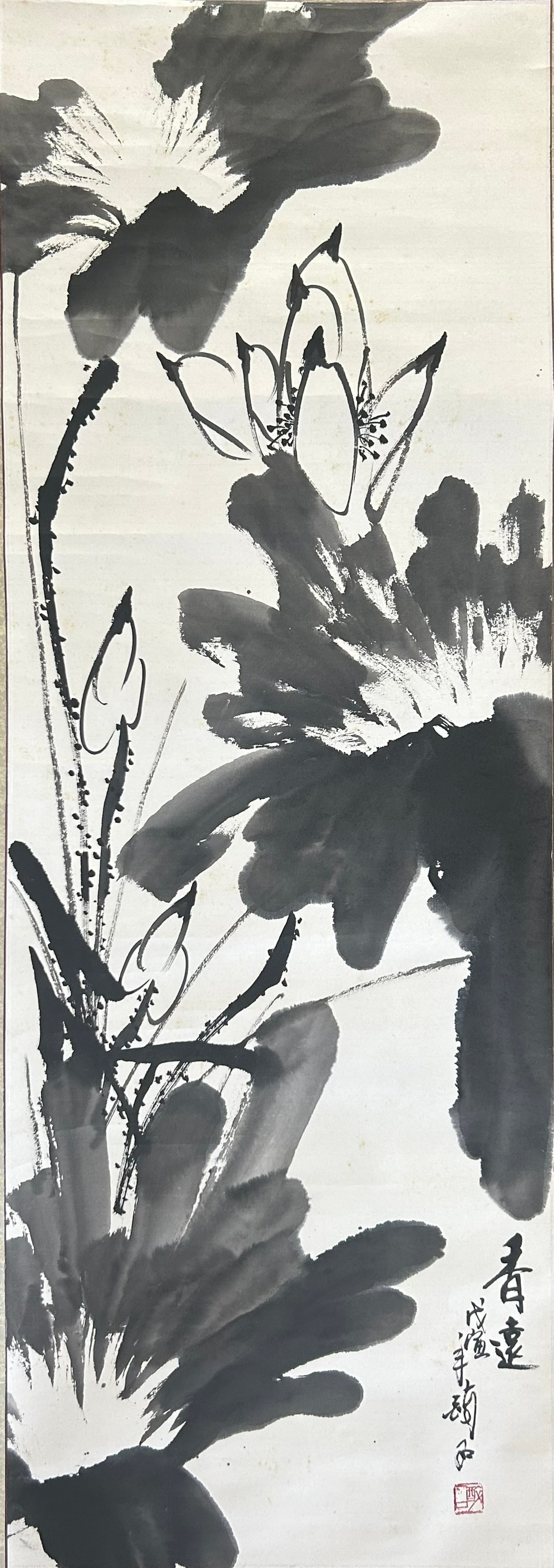 A Chinese Painting of Lotus: Ink on paper, a signature and a seal of the artist, 51 in. x 18 in. for the painting, 75.1/2 in. x 21 in. overall.