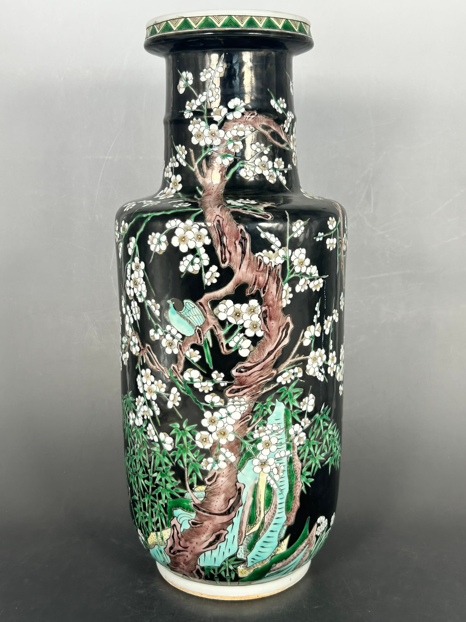 A Chinese Famille Noir Rouleau Porcelain Vase: 16 in. high, 6.1/2 in. wide.