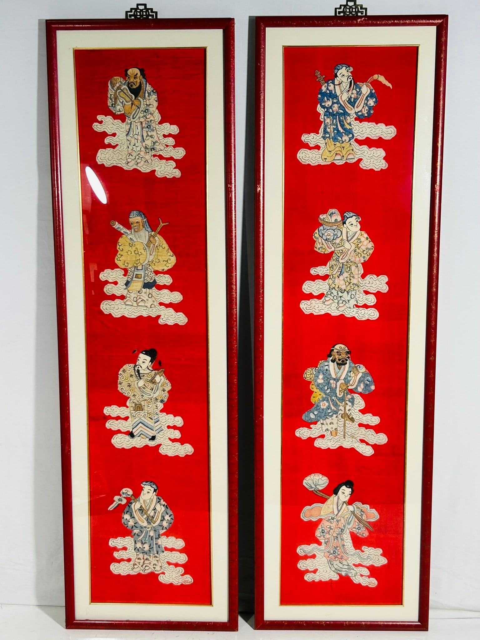 A Pair of Chinese Silk Embroidered 'Eight Immortals' Panels: 61.75 in. x 18.25 in. overall each. From a Florida Estate Sale.