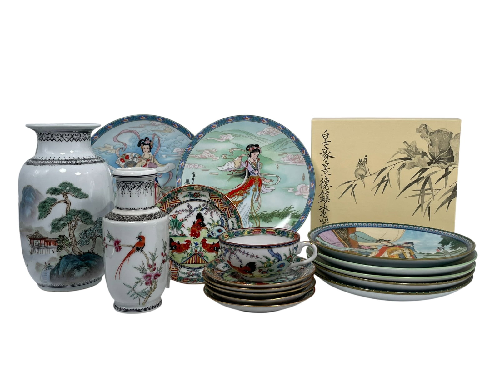 A Group of Sixteen Chinese Porcelain Ware, 20th Century: Comprising a larger famille rose 'landscape' vase, 8.1/2 in. high, 4.1/2 in. wide; a smaller famille rose 'bird and flower' vase, 6.1/2 in. high, 2.3/4 in. wide; a famille rose gilt-decorated
