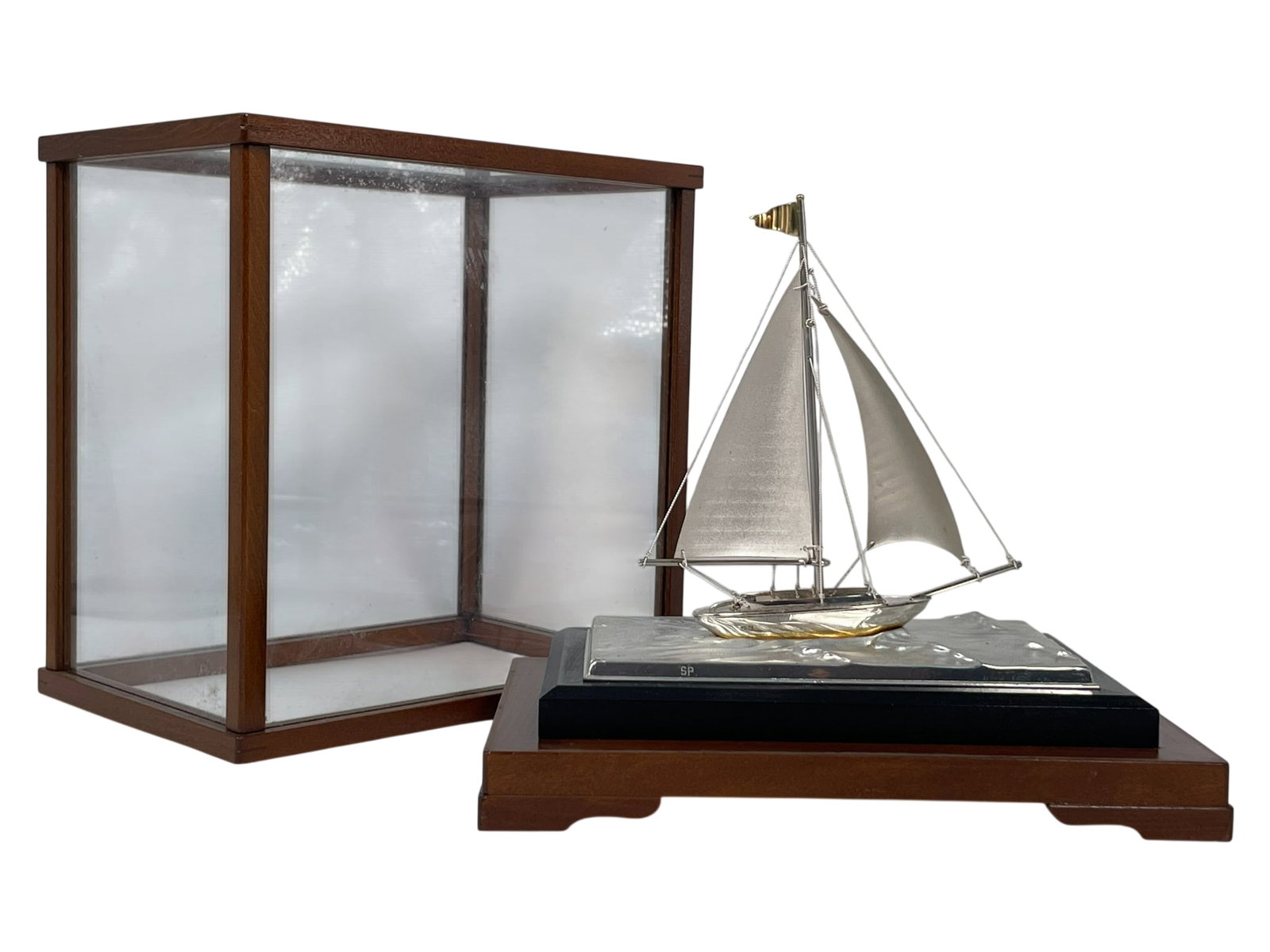 A Japanese Silver Boat: With a covering case. 5.1/2 in. high, 5.1/4 in. wide for the silver boat; 8.1/4 in. high, 7.1/2 in. wide for the case.