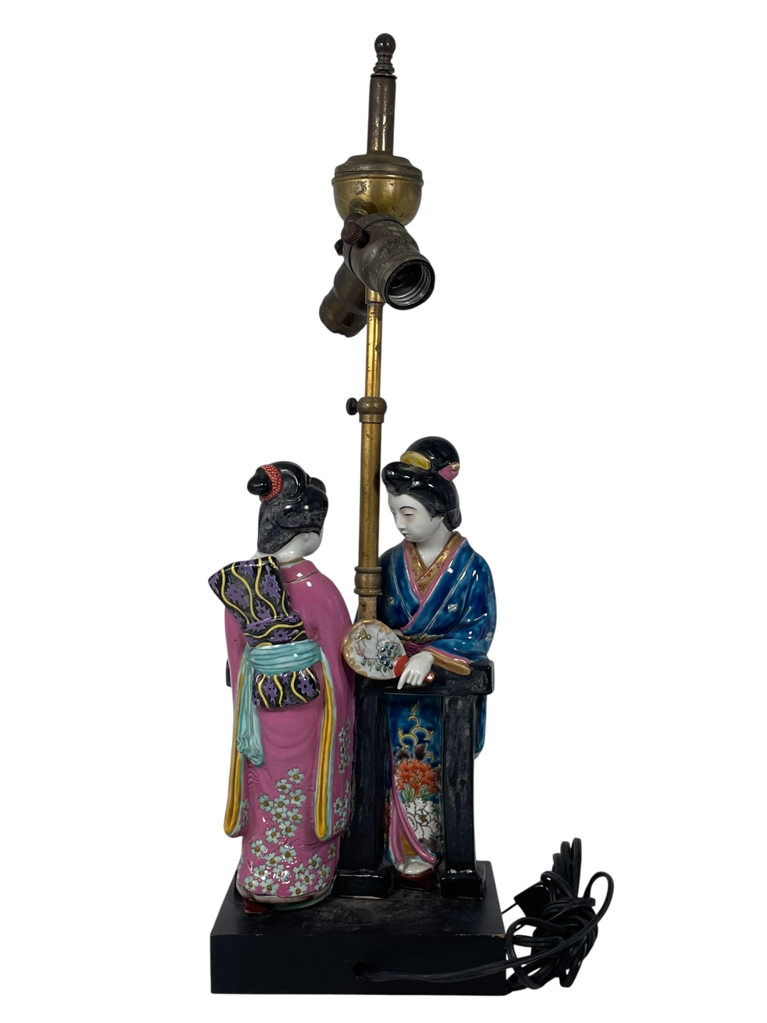 A Japanese Porcelain Figural Group of Two Geisha: Mounted as a lamp. 21.1/2 in. high, 6.3/4 in. wide overall including the base.