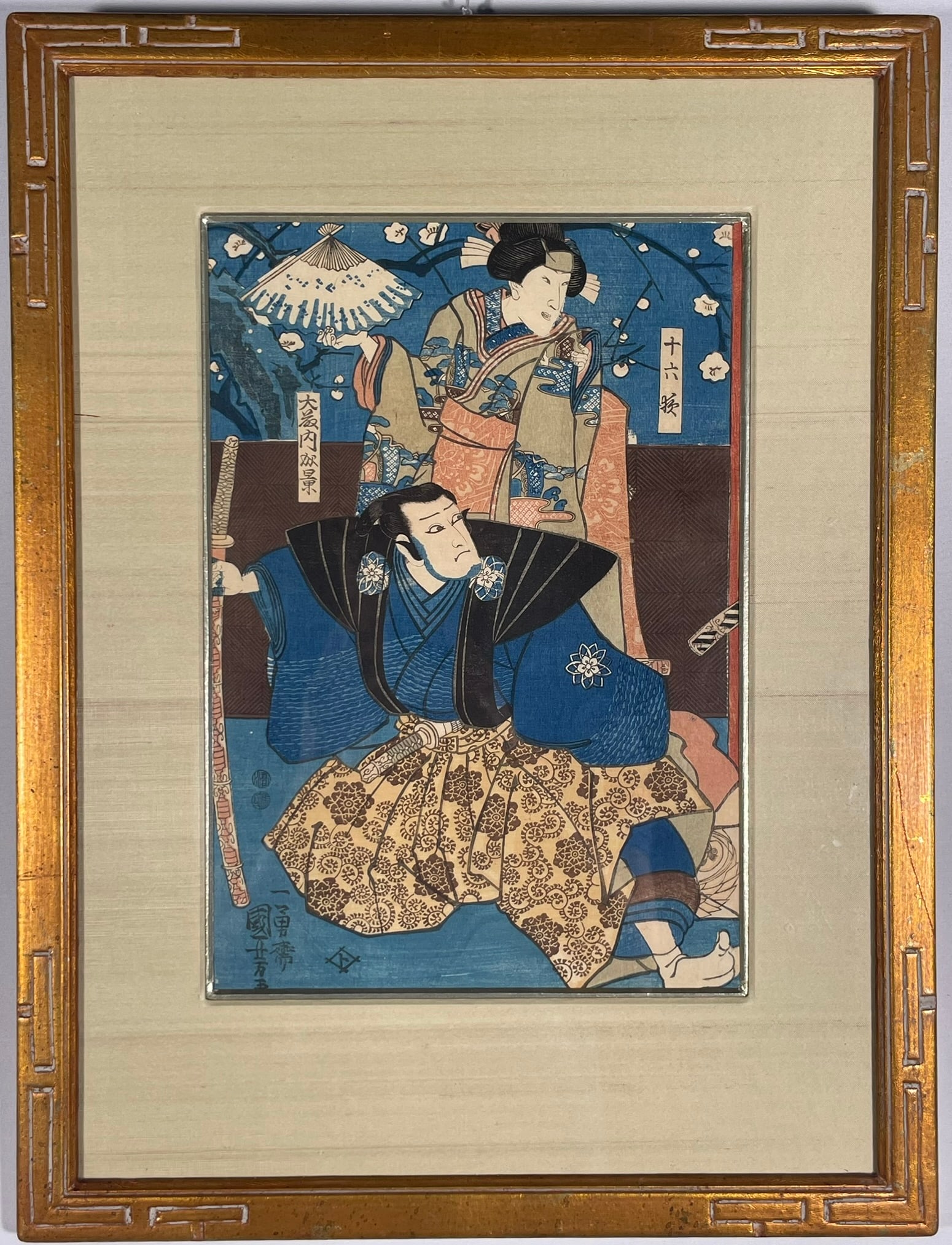 A Japanese Woodblock Print, a Signature Utagawa Kuniyoshi: 21 in. x 15.3/4 in. overall including the frame.