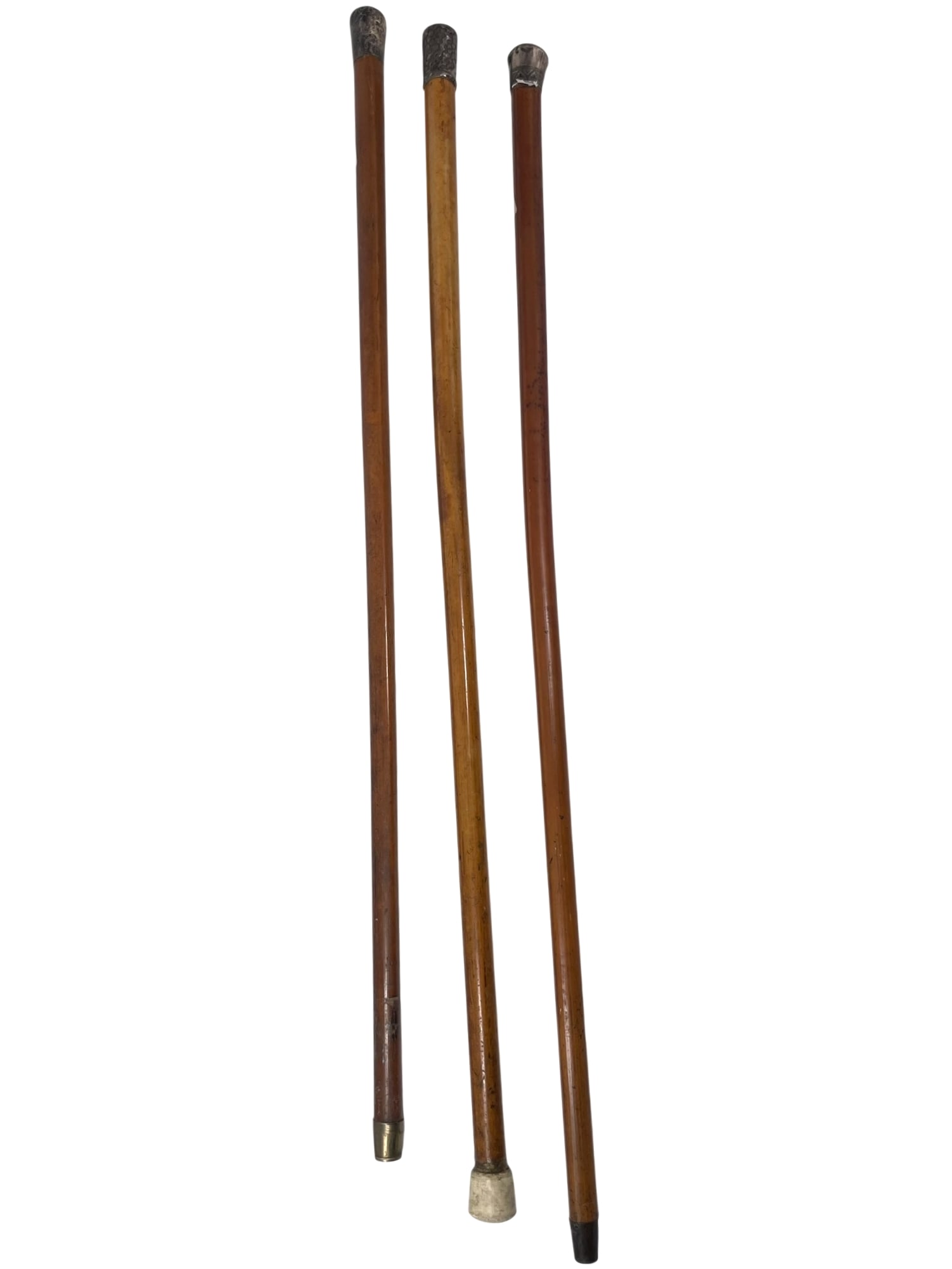 A Group of Three Canes with Silver Handles: The longest one measures 34.3/4 in. long.