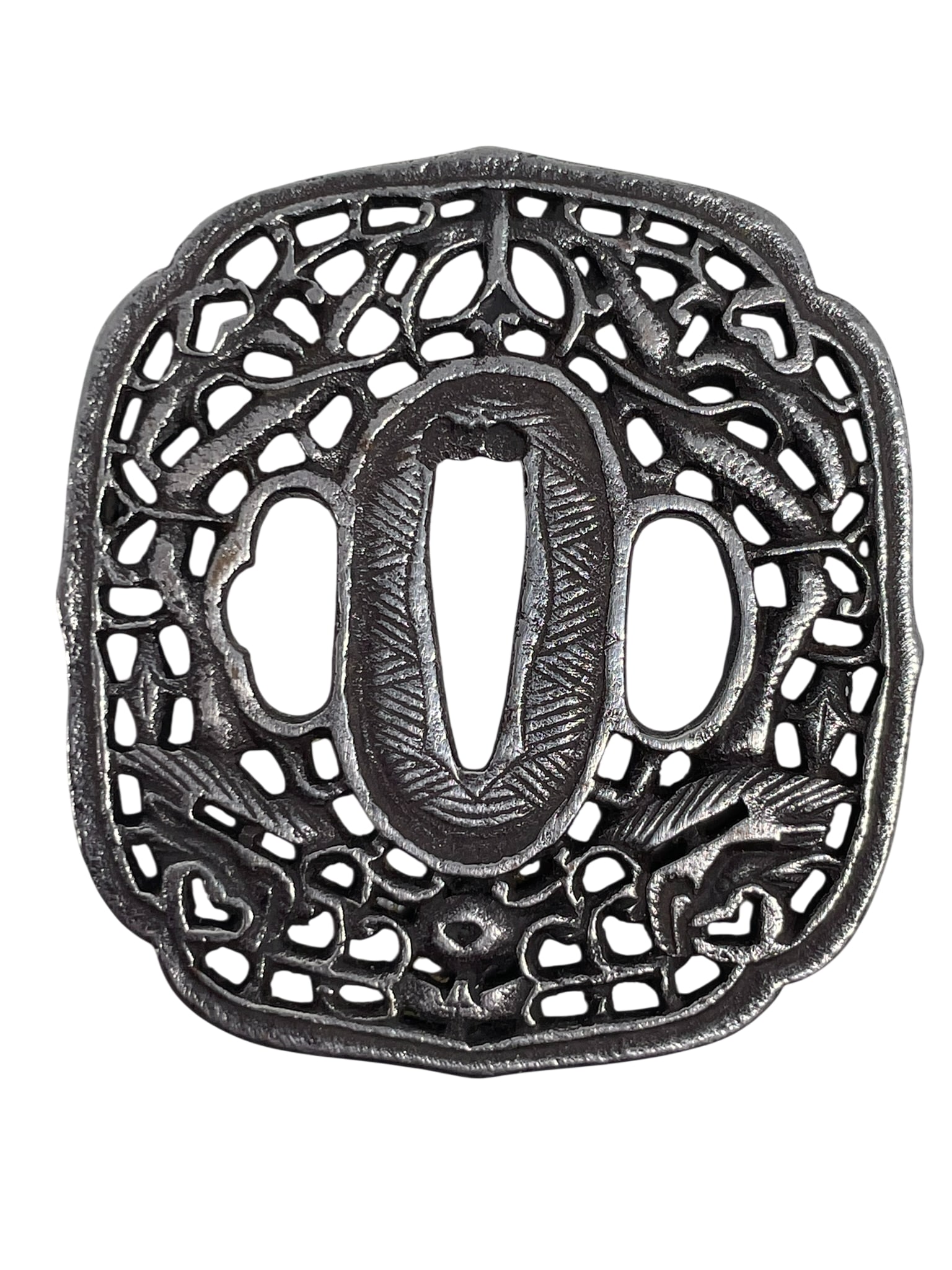 A Japanese Iron Tsuba: 2.3/4 in. long, 2.1/2 in. wide.