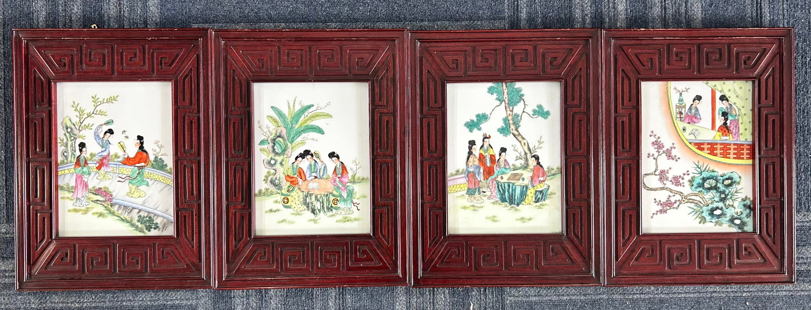 A Set of Four Chinese Famille Rose Porcelain 'Dream of the Red Chamber' Plaques: All framed, the plaques measures 11.1/2 in. x 8.3/4 in. each; 19.1/2 in. x 14.1/2 in. each for the frames.