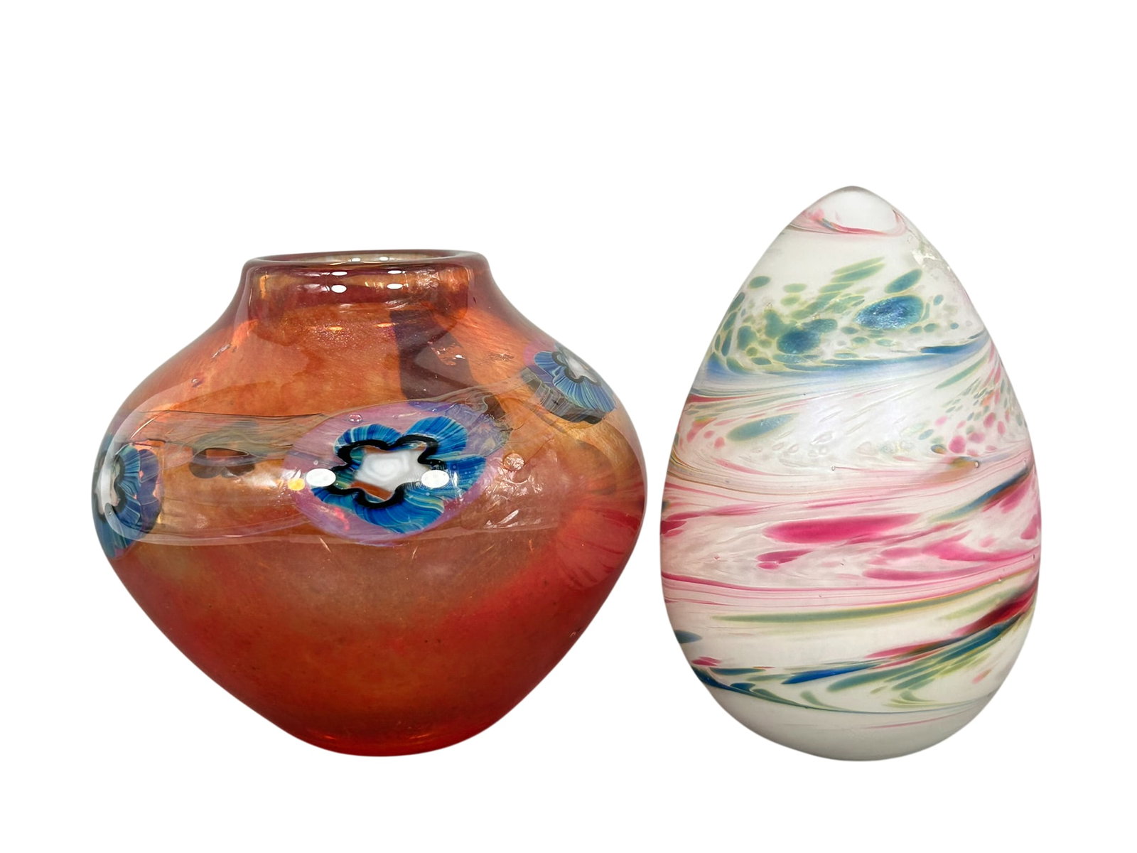 Two Glass Decorative Objects: Comprising a iridescent art glass egg, 5.1/8 in. high, 3.3/8 in. wide; and a art glass vase, a maker's mark on the bottom, 4.1/2 in. high, 5.1/4 in. wide.