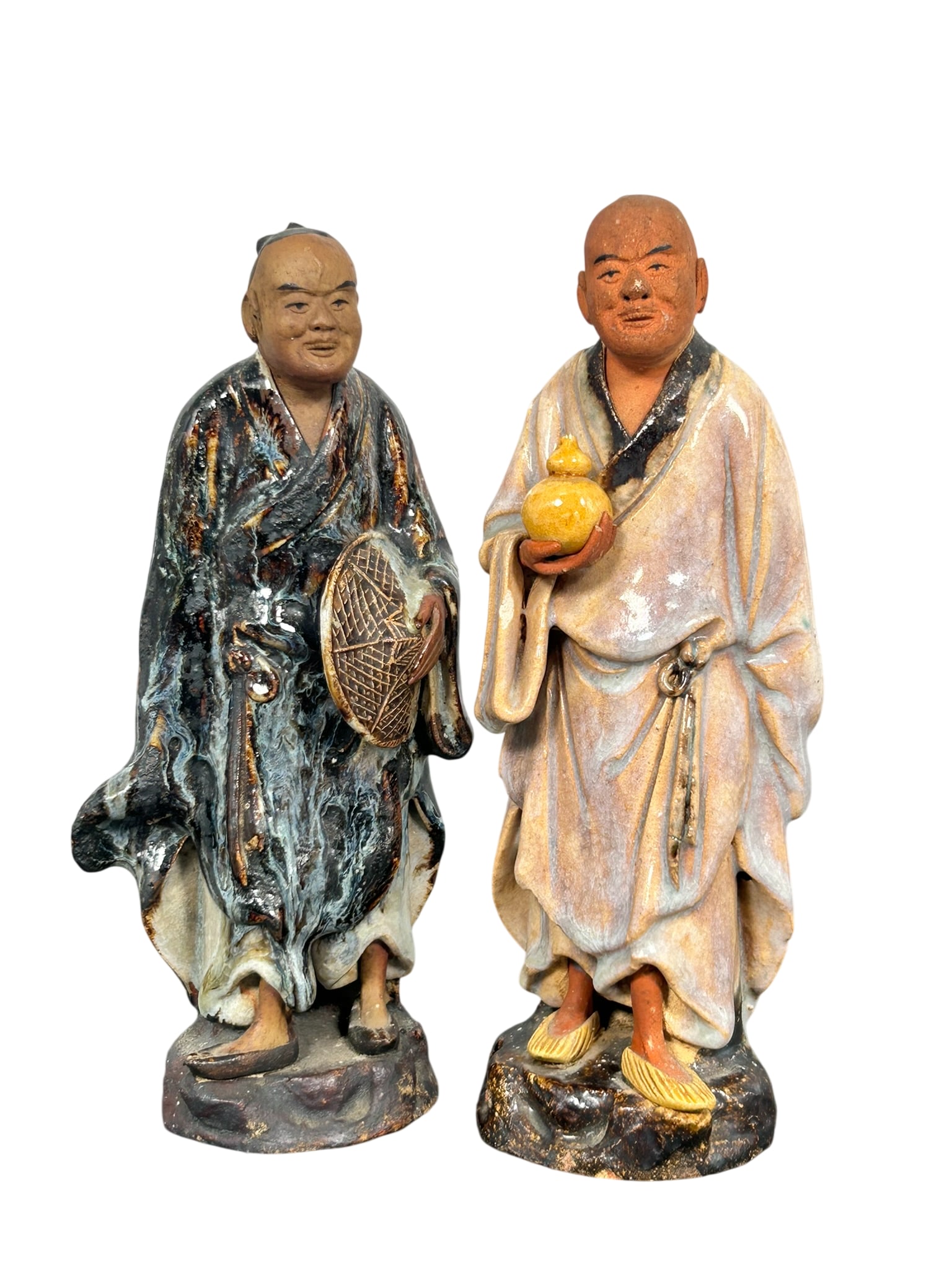 Two Chinese Shiwan Pottery Figures: 8 in. high, 3 in. wide each.