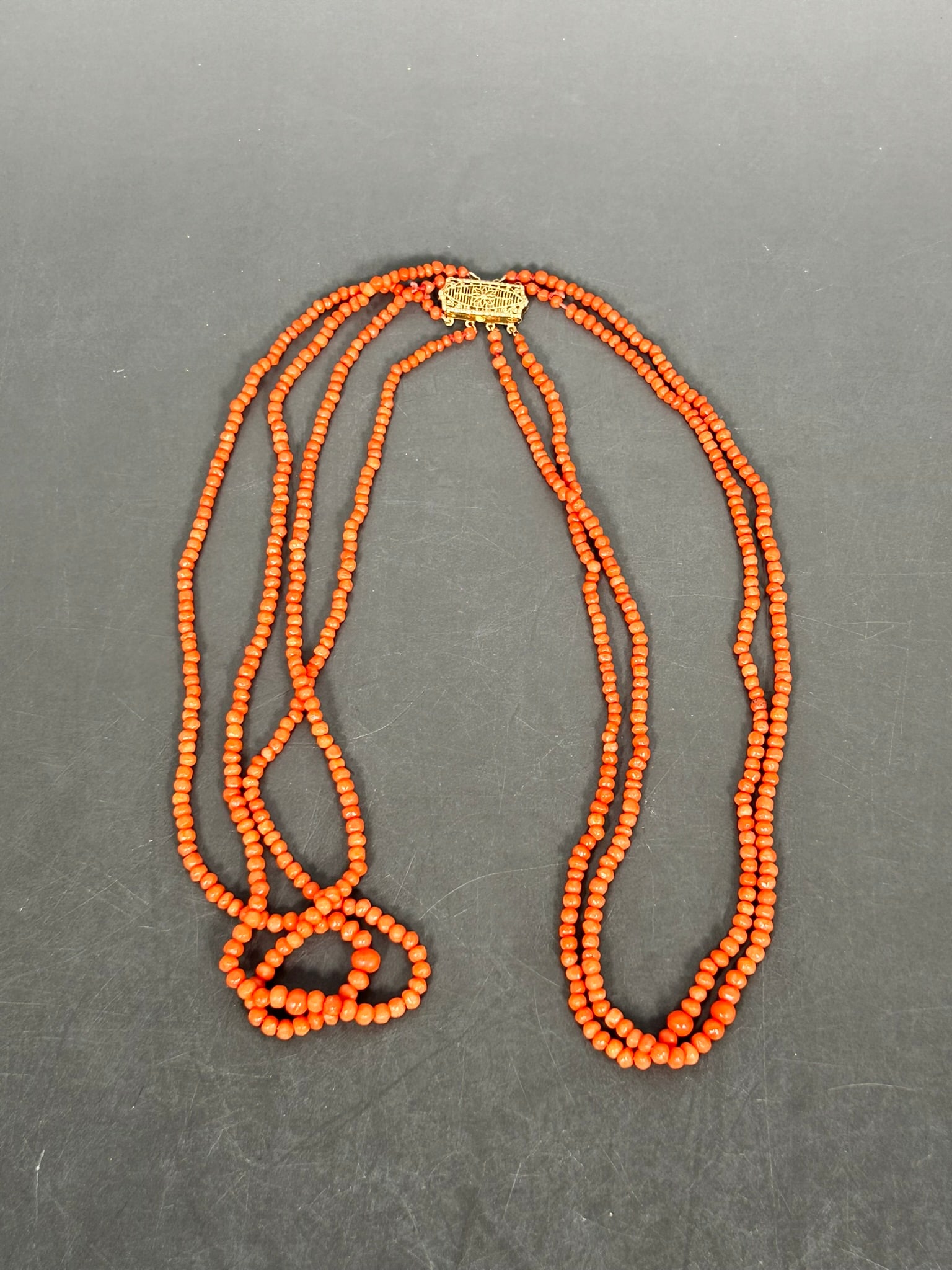 A Four-Strand Coral Beads, Necklace: 15.1/2 in. long.