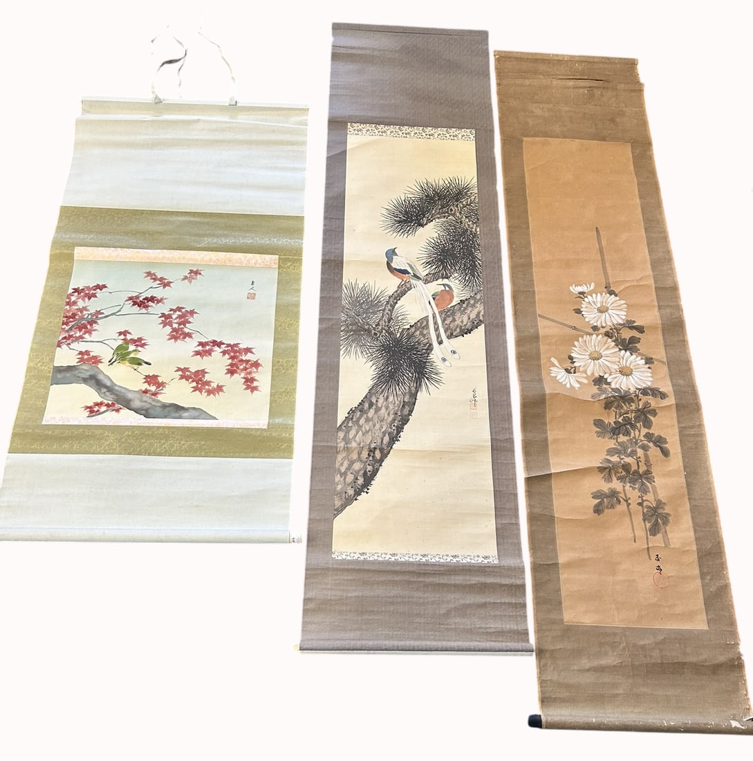 A Group of Three Japanese Paintings of Birds and Flowers: Comprising a painting of birds and flower, a signature of the artist and a seal, 50 in. x 25 in. overall; a painting of birds and pine tree, a signature of the artist and two seals, 72 in. x 19 in.