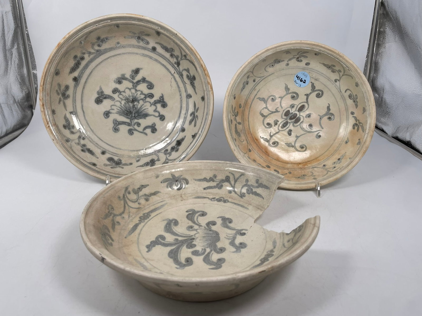 A Group of Three Hoi An Hoard Vietnamese Blue and White Dishes: The largest measures 10 in. diam. A Private Collection of a Retiring University Professor.