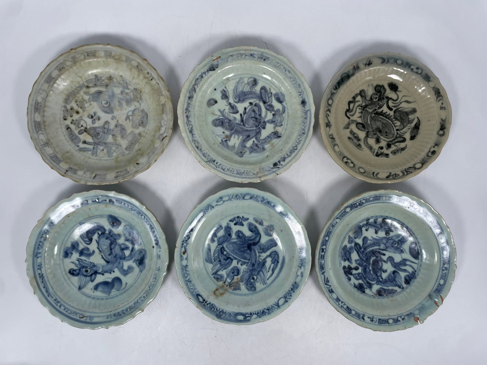 A Group of Six Chinese Blue and White Dishes, Ming Dynasty: 7.5/8 in. diam. each. Provenance: From the renowned John Allen Tabor Collection. John Tabor (1917?1991), a U.S. Foreign Service officer with USAID, worked throughout Asia in the 1960s and assembled th