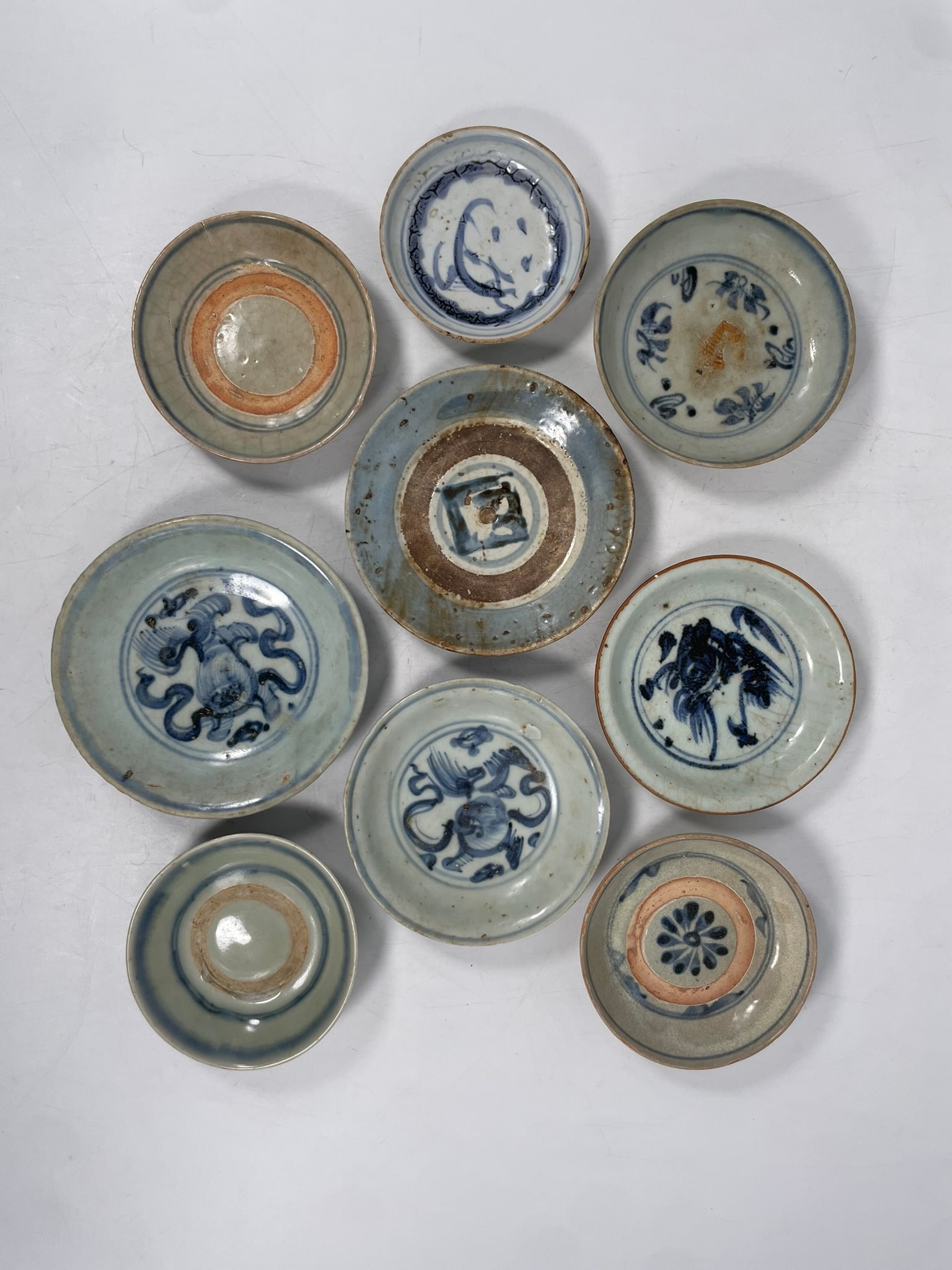 A Group of Nine Chinese Small Blue and White Dishes, Ming Dynasty: The largest measures 5.3/8 in. diam. Provenance: From the renowned John Allen Tabor Collection. John Tabor (1917?1991), a U.S. Foreign Service officer with USAID, worked throughout Asia in the 1960s a
