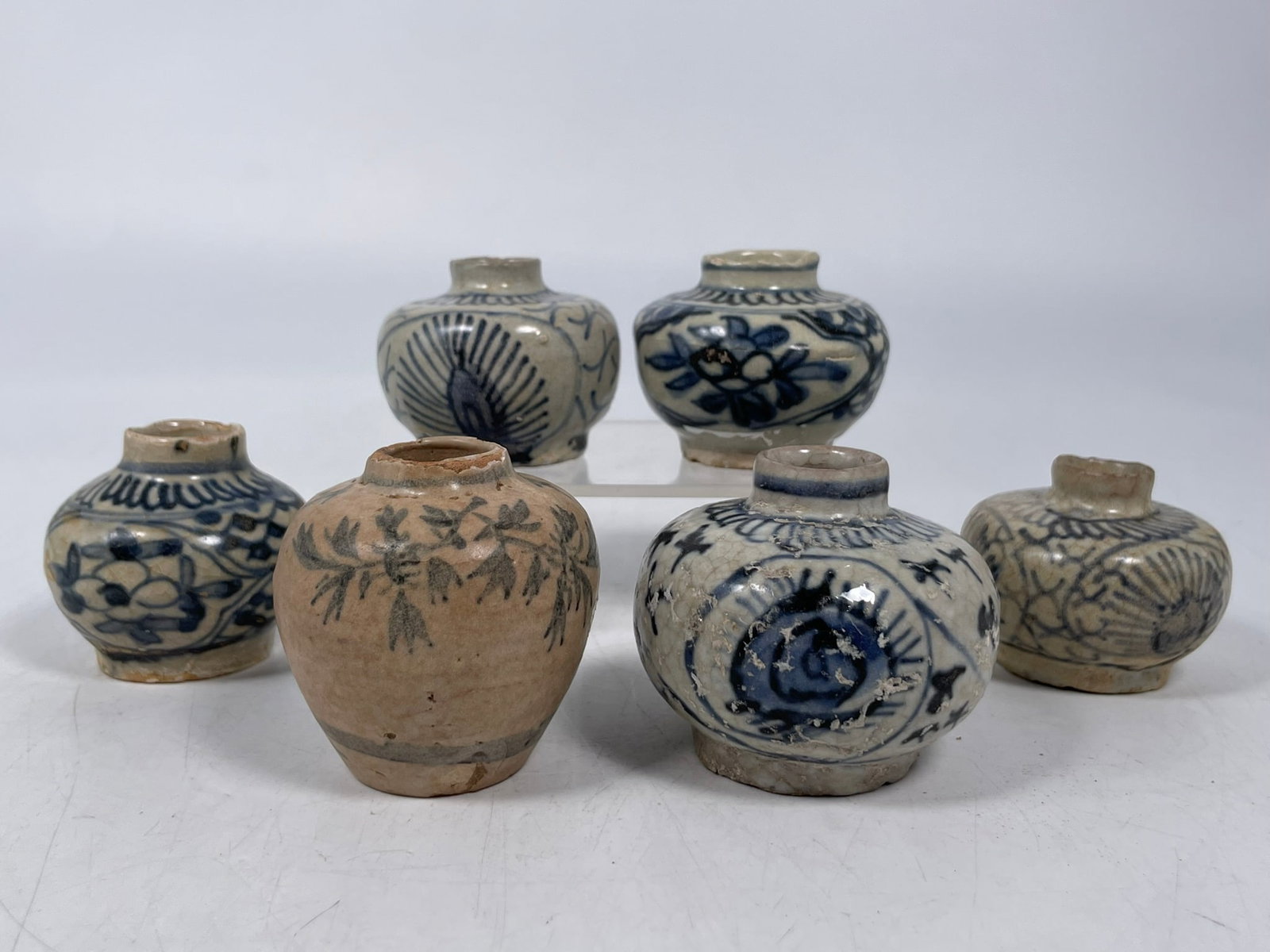 A Group of Six Chinese Miniature Blue and White Porcelain Jarlets, Ming Dynasty: The largest measures 2.1/4 in. high, 2.1/2 in. diam. Provenance: From the renowned John Allen Tabor Collection. John Tabor (1917?1991), a U.S. Foreign Service officer with USAID, worked throughout Asi