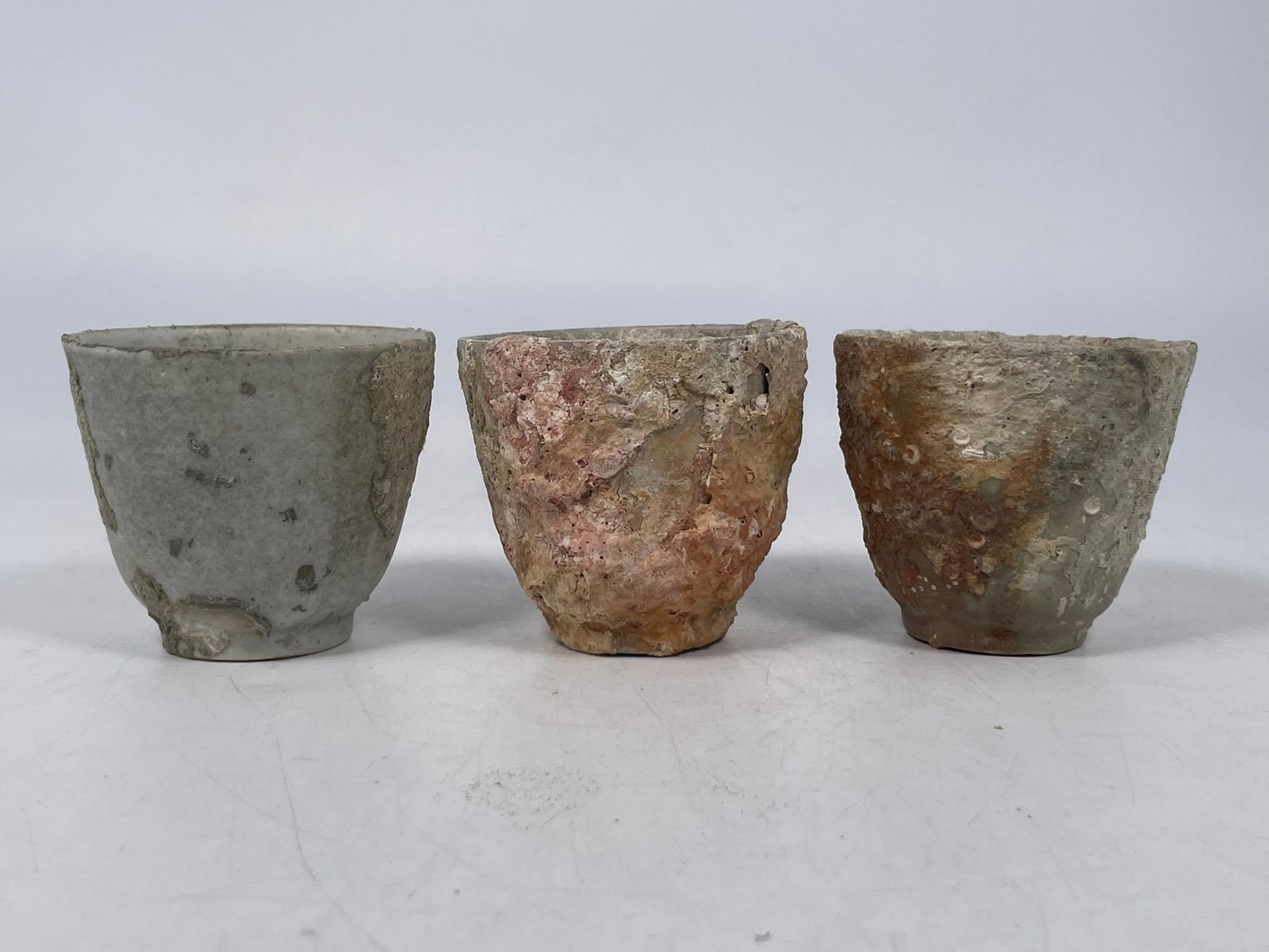A Group of Three Porcelain Cups: Probably excavated from the famous Hoi An shipwreck cargo but without any stickers or tags. 2.3/4 in. high, 3.1/8 in. diam. each. A Private Collection of a Retiring University Professor.