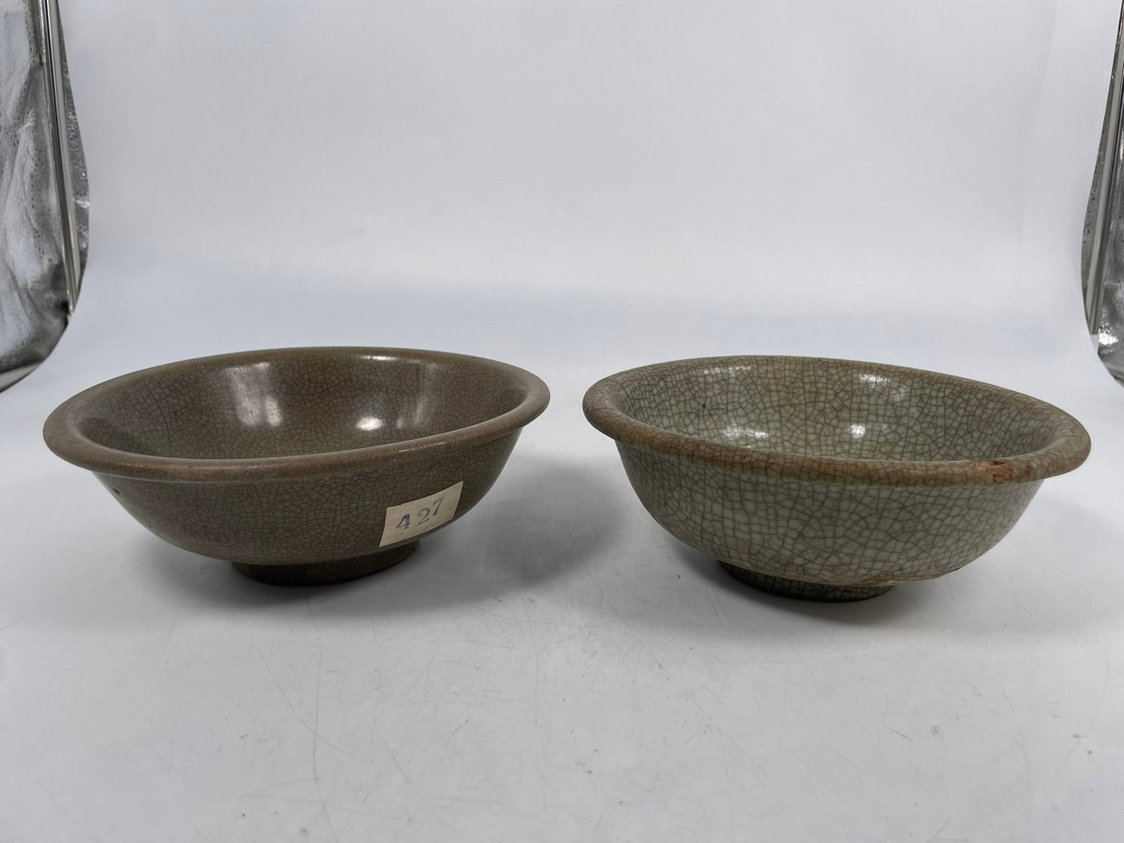 Two Chinese Celadon and Crackle-Glazed Bowls, Ming Dynasty: 2.3/4 in. high, 7.3/8 in. diam. each. A Private Collection of a Retiring University Professor.