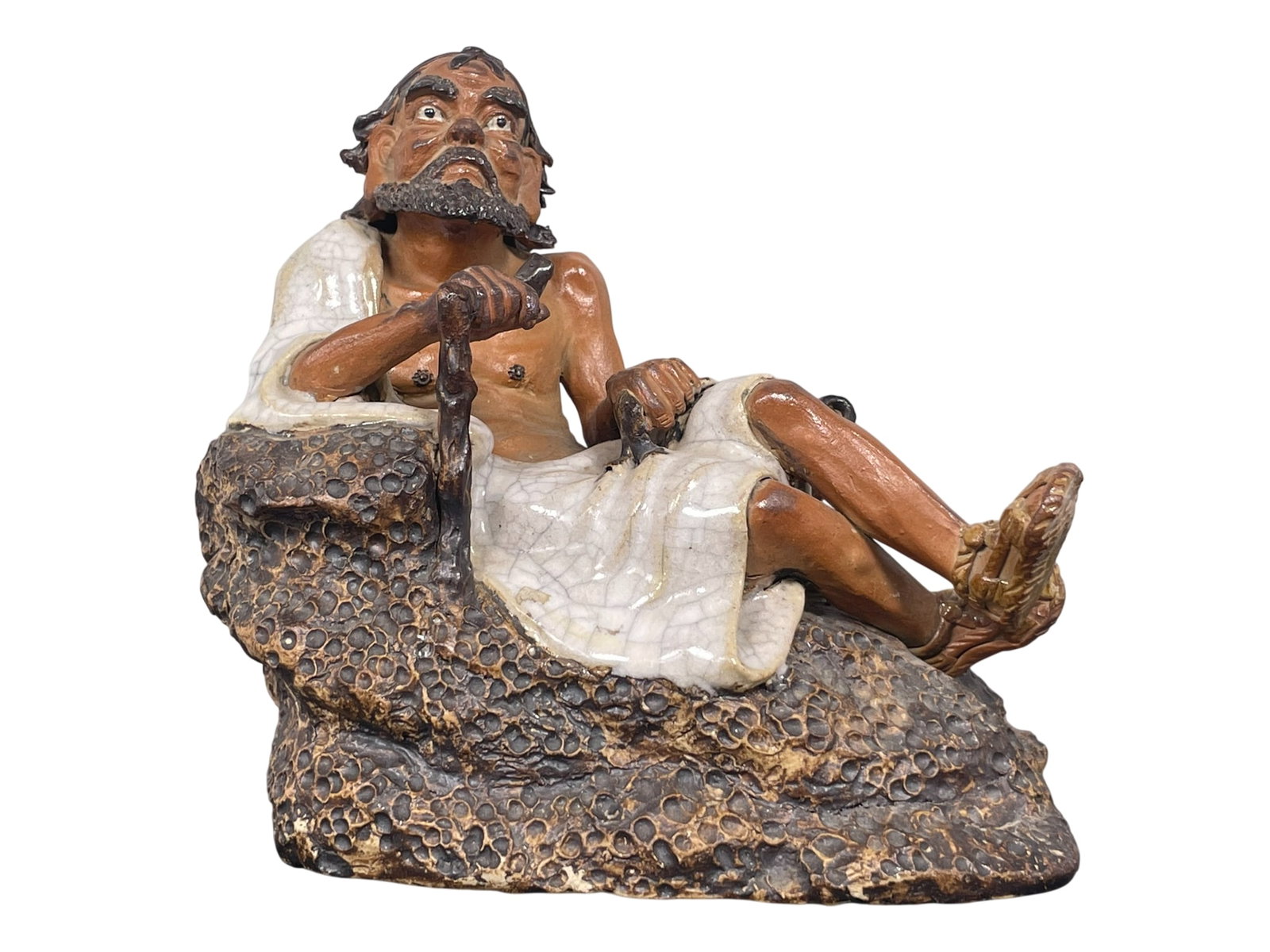 A Chinese Shiwan Pottery Figure of Li Tieguai: A studio mark to the interior of the bottom. 7.1/2 in. high, 7.1/2 in. wide.