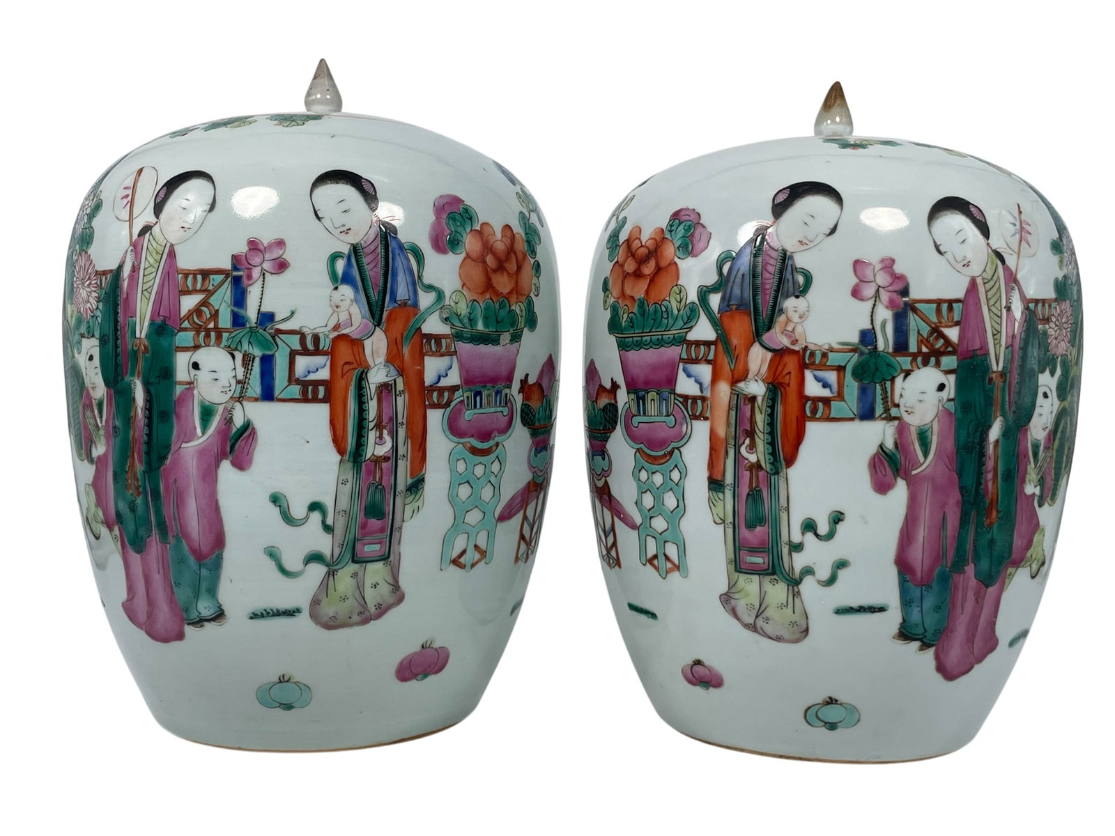 A Pair of Chinese Famille Rose 'Ladies and Boys' Porcelain Jars and Covers: 11.1/2 in. high, 8.1/2 in. wide each.