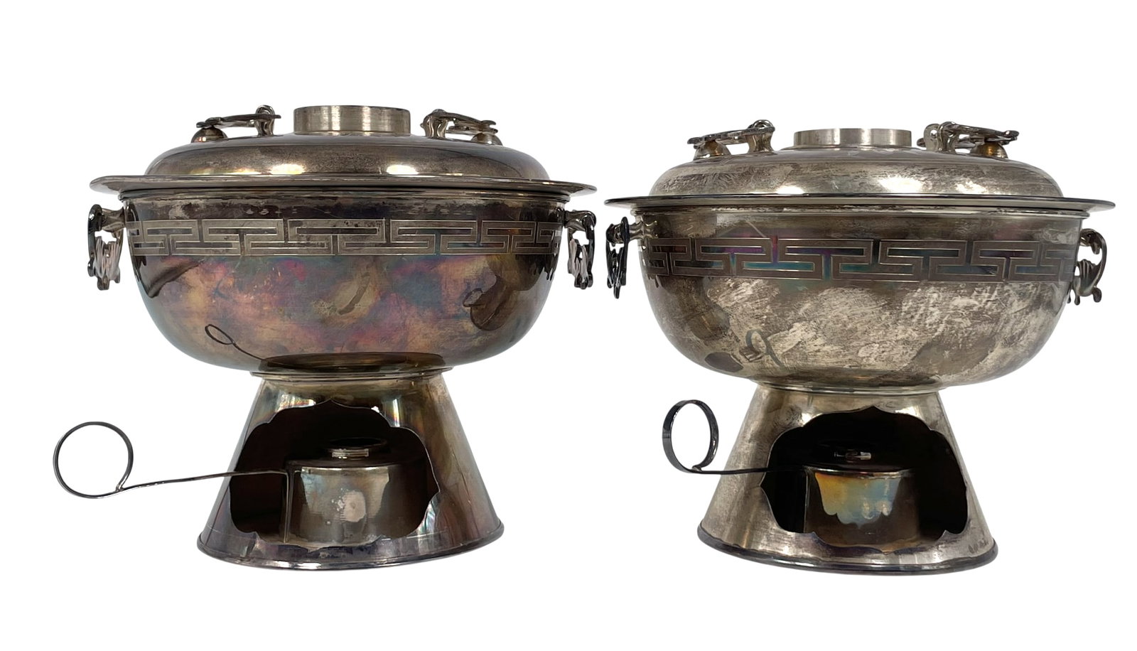 A Pair of Korean Silver Sinseollo, Hot Pot, 'Soon-eun' marks, a Shinsegae's Label: A 'Soon-eun' mark to the bottom of each hot pot. 5.3/4 in. high, 7 in. wide each.