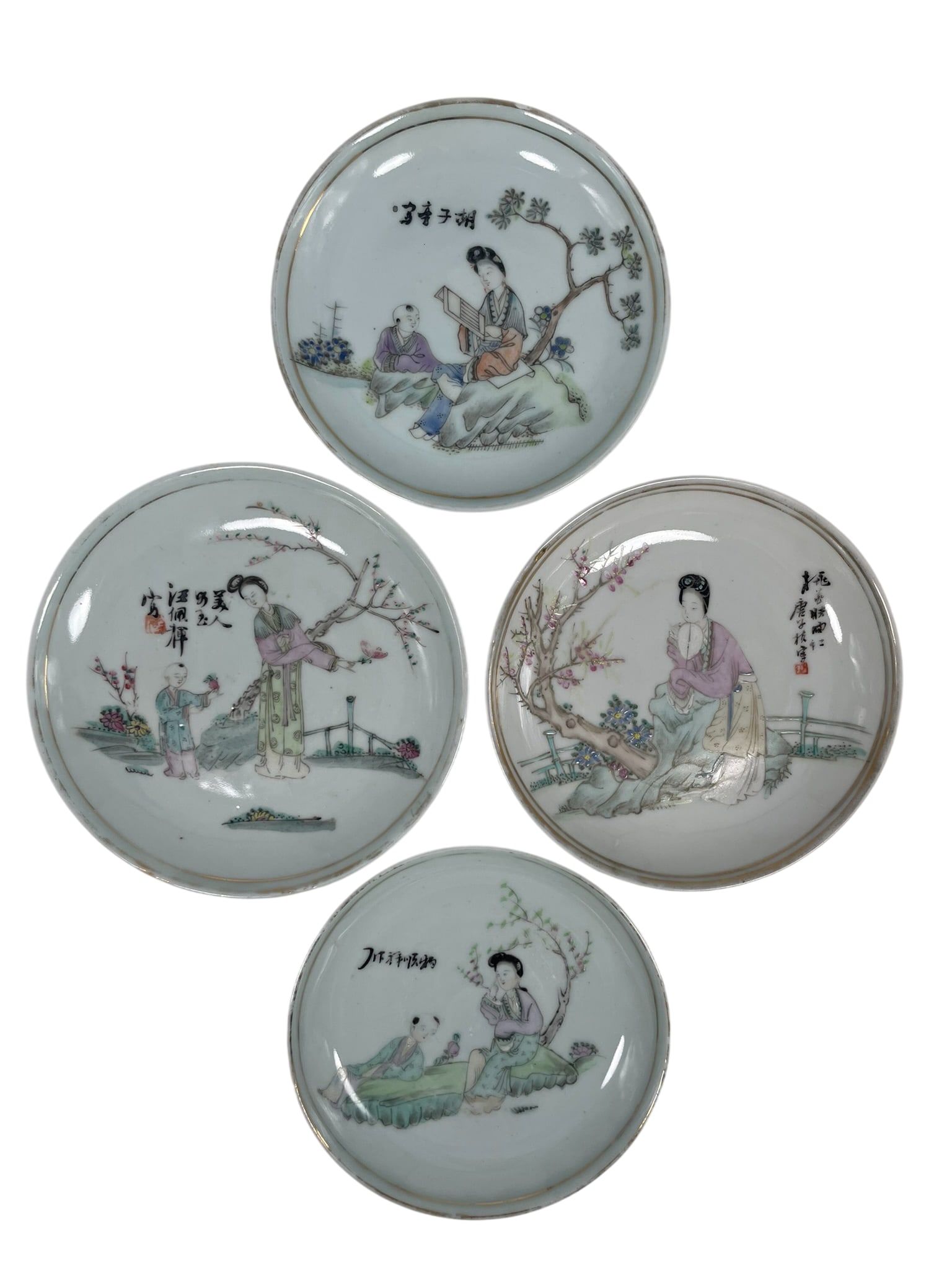 A Group of Four Chinese Small Famille Rose 'Lady and Boy' Porcelain Dishes: Three of the dishes with studio marks of 'Wang Yongshun Zao', 'Hu Taimao Zao', and 'Tang Yiyuan Hao'. The largest measures 5.1/4 in. diam.