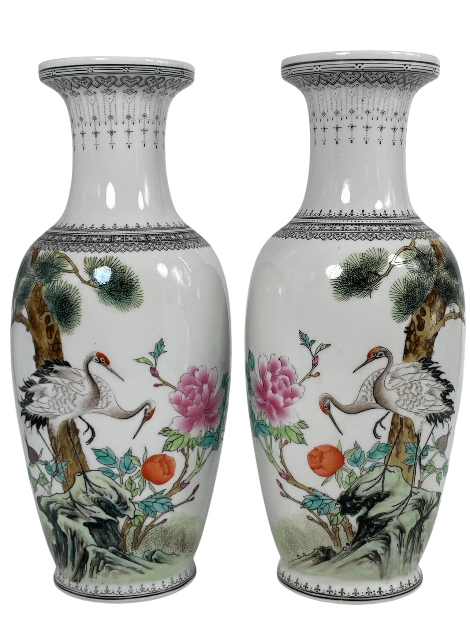 A Pair of Chinese Famille Rose 'Crane, Pine Tree, and Peony' Porcelain Vases, 20th Century: 12 in. high, 4.3/4 in. wide each.