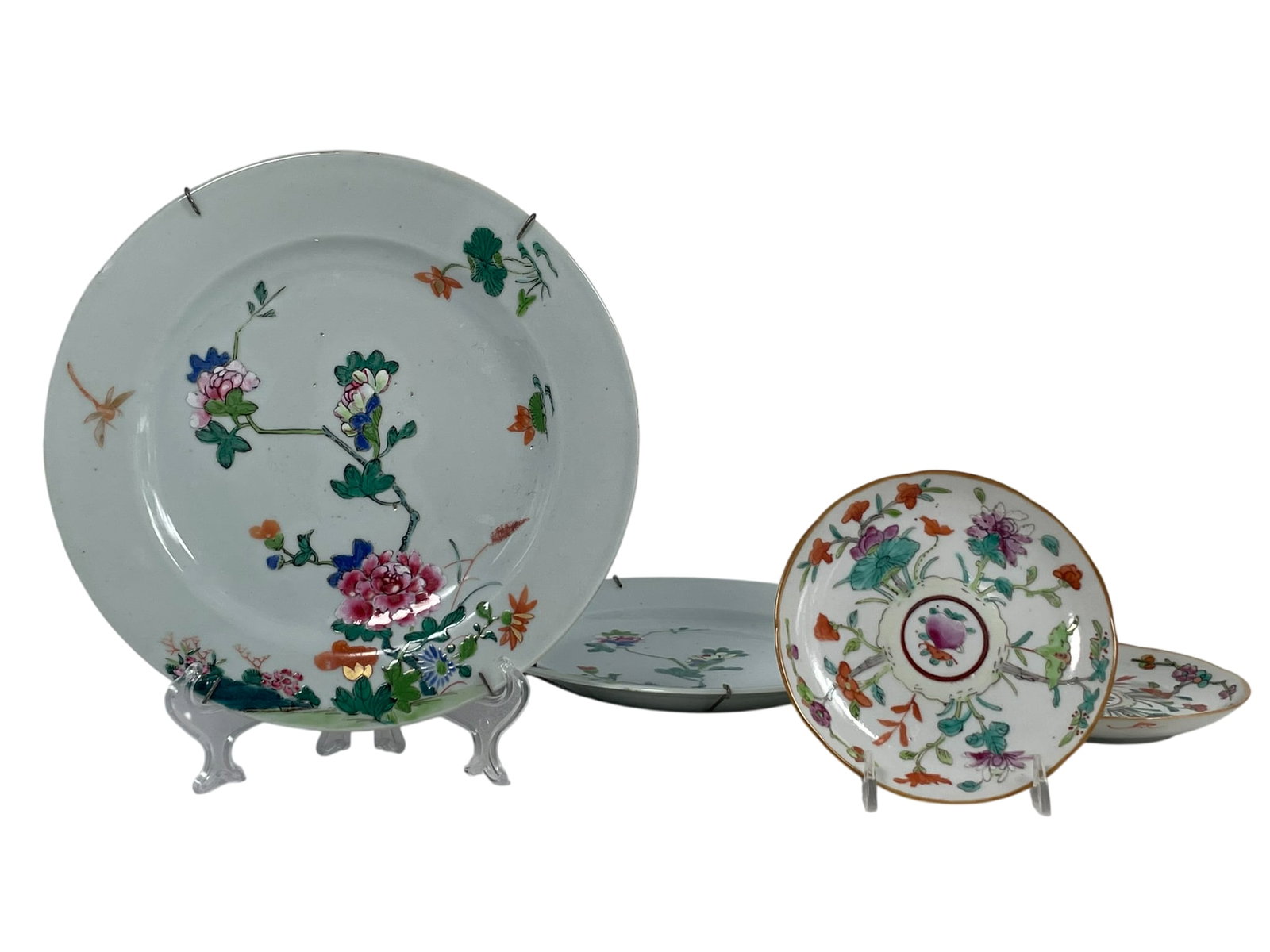 A Group of Four Chinese Famille Rose Porcelain Dishes, Qing Dynasty: Comprising a pair of small pair of 'peach and flower' dishes, apocryphal Chenghua marks to the undersides, 5.3/8 in. diam. each; a pair of 'peony' dishes, 9 in. diam. each.