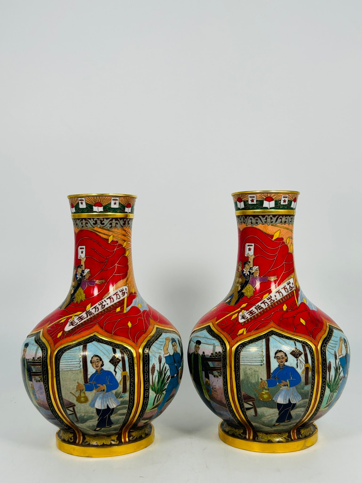 A Pair of Chinese Cloisonne Enamel 'Revolutionary Opera' Bottle Vases, 20th Century: Featured with the scene of Cultural Revolution, 10.1/2 in. high, 6 in. wide each.