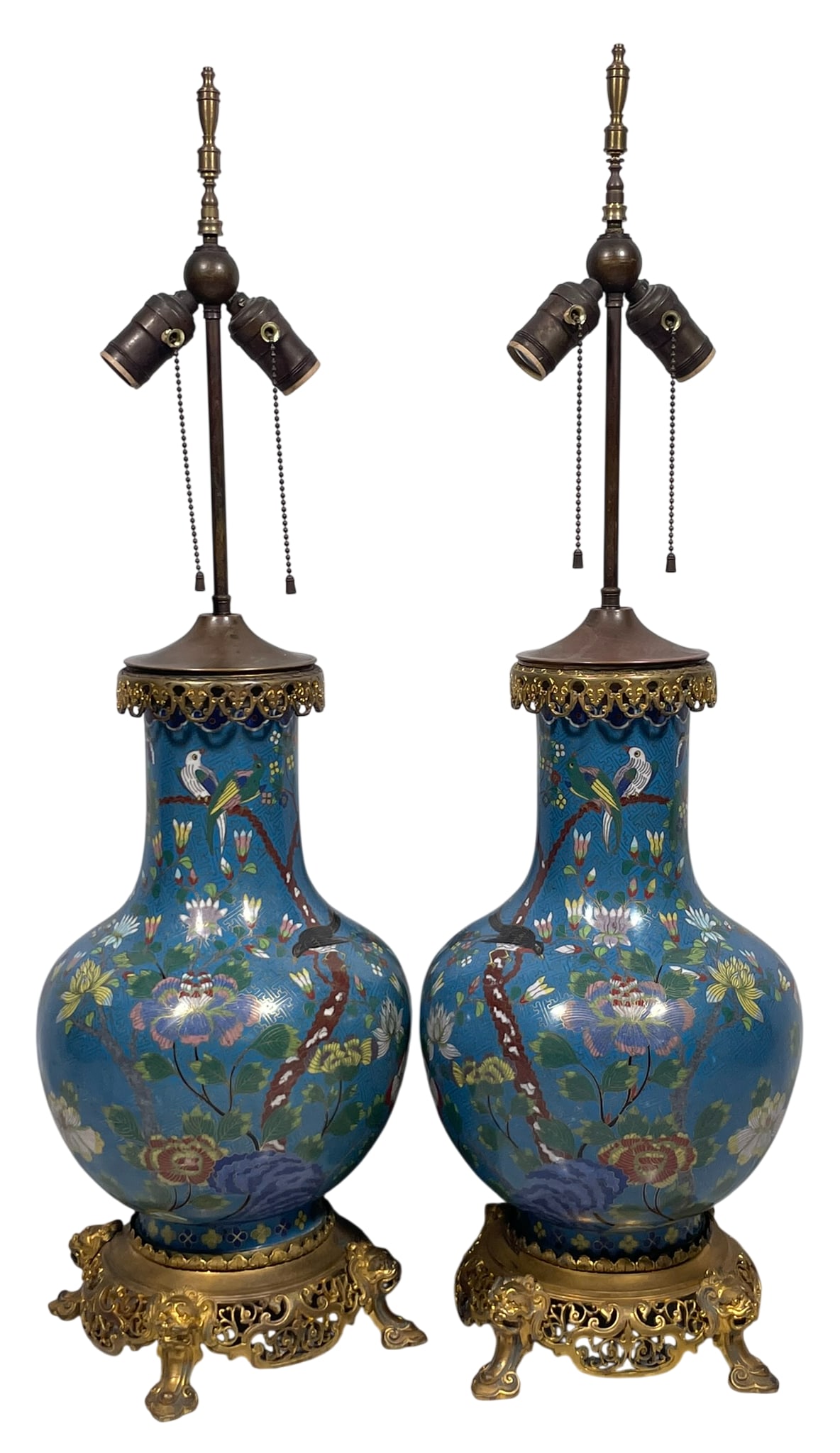 A Pair of Chinese Cloisonne Enamel Vases: Both mounted as lamps. 14.1/2 in. high, 9 in. wide each for the vases; 32 in. high, 9 in. wide each overall.