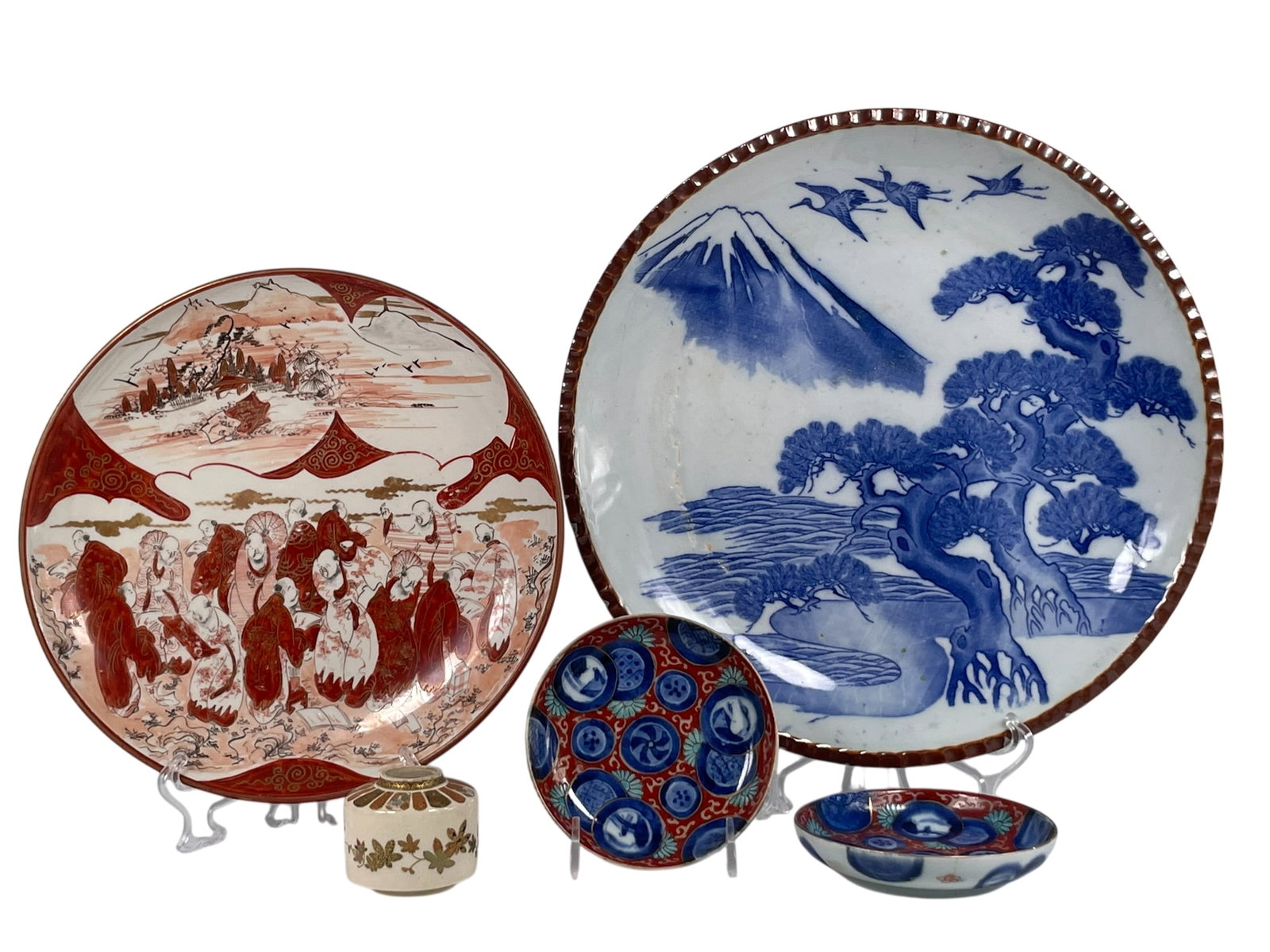 A Group of Five Japanese Pottery/Porcelain Ware: Comprising a large Yamatoku blue and white dish, a Yamatoku mark to the underside, 12 in. diam.; a Kutani dish, 9.1/2 in. diam.; a small pair of Imari dishes, 4.3/8 in. diam. each; and a miniature Sat