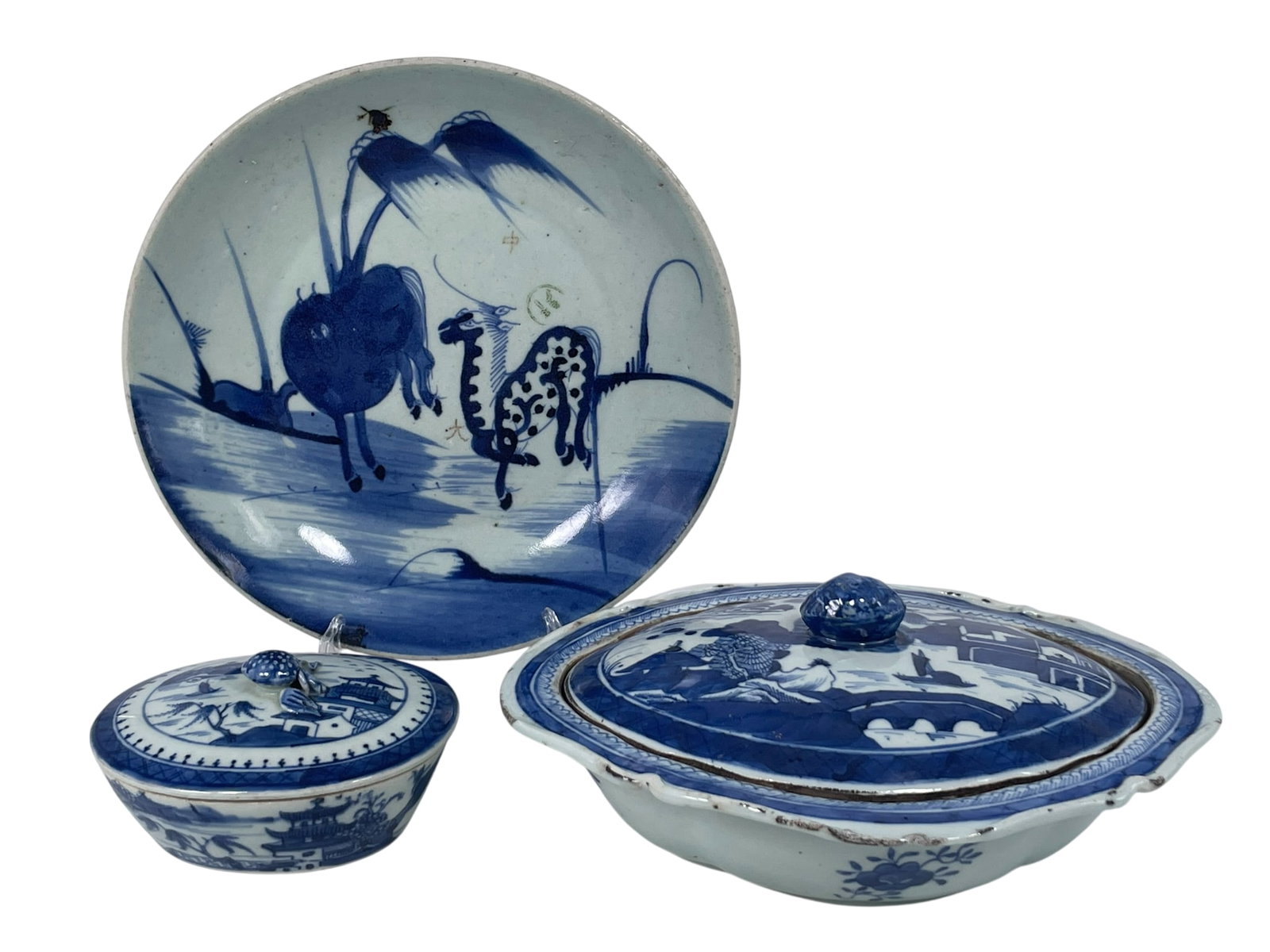 Three Chinese Blue and White Porcelain Ware, Qing Dynasty: The larger tureen measures 4 in. high, 10.1/2 in. wide; the smaller tureen measures 3 in. high, 5.1/4 in. wide; and the dish measures 10 in. diam.