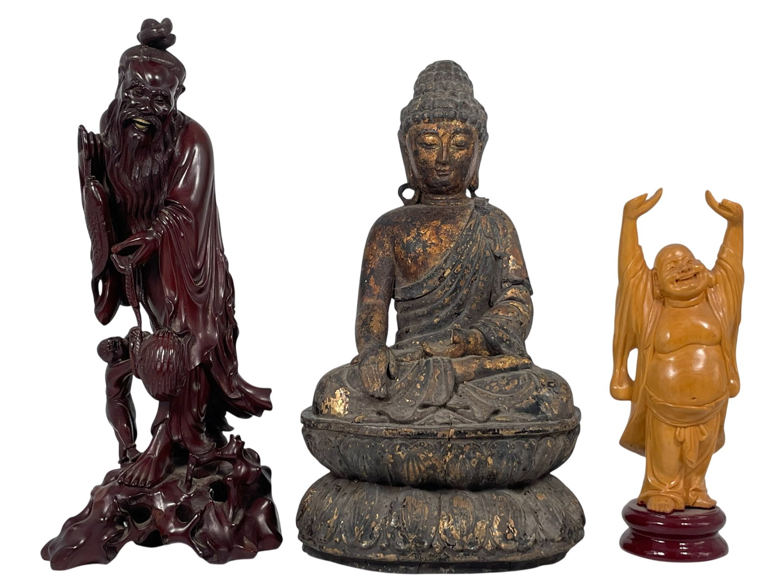 A Group of Three Carved Wood Figures: Comprising a carved gilt-wood figure of a seated Buddha, a carved wood figural group of Fisherman and boy, 13 in. high, 6 in. wide; and a carved figure of Budai, 9 in. high, 3 in. wide.
