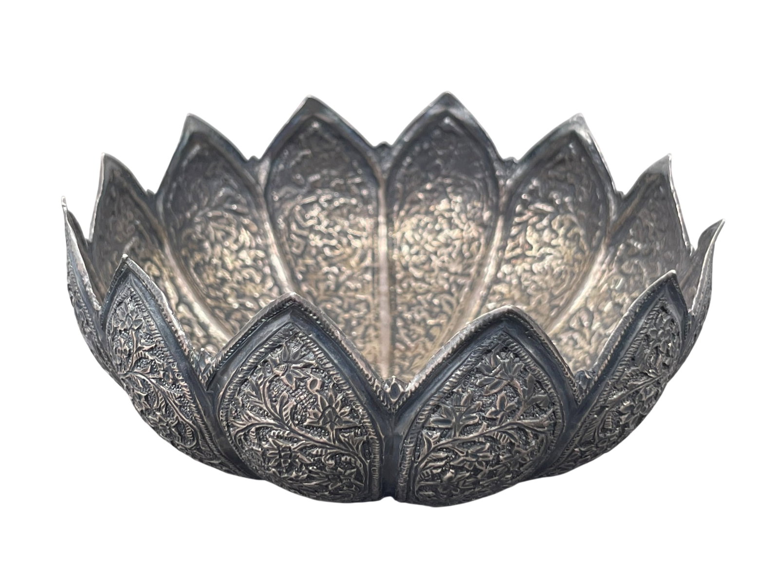An Anglo-Indian Sterling Silver Repousse Lotus Bowl, Late 19th to Early 20th Century: 2 in. high, 4.1/2 in. diam., 42 grams. Provenance: Yi Bao Tang Collection, North America.