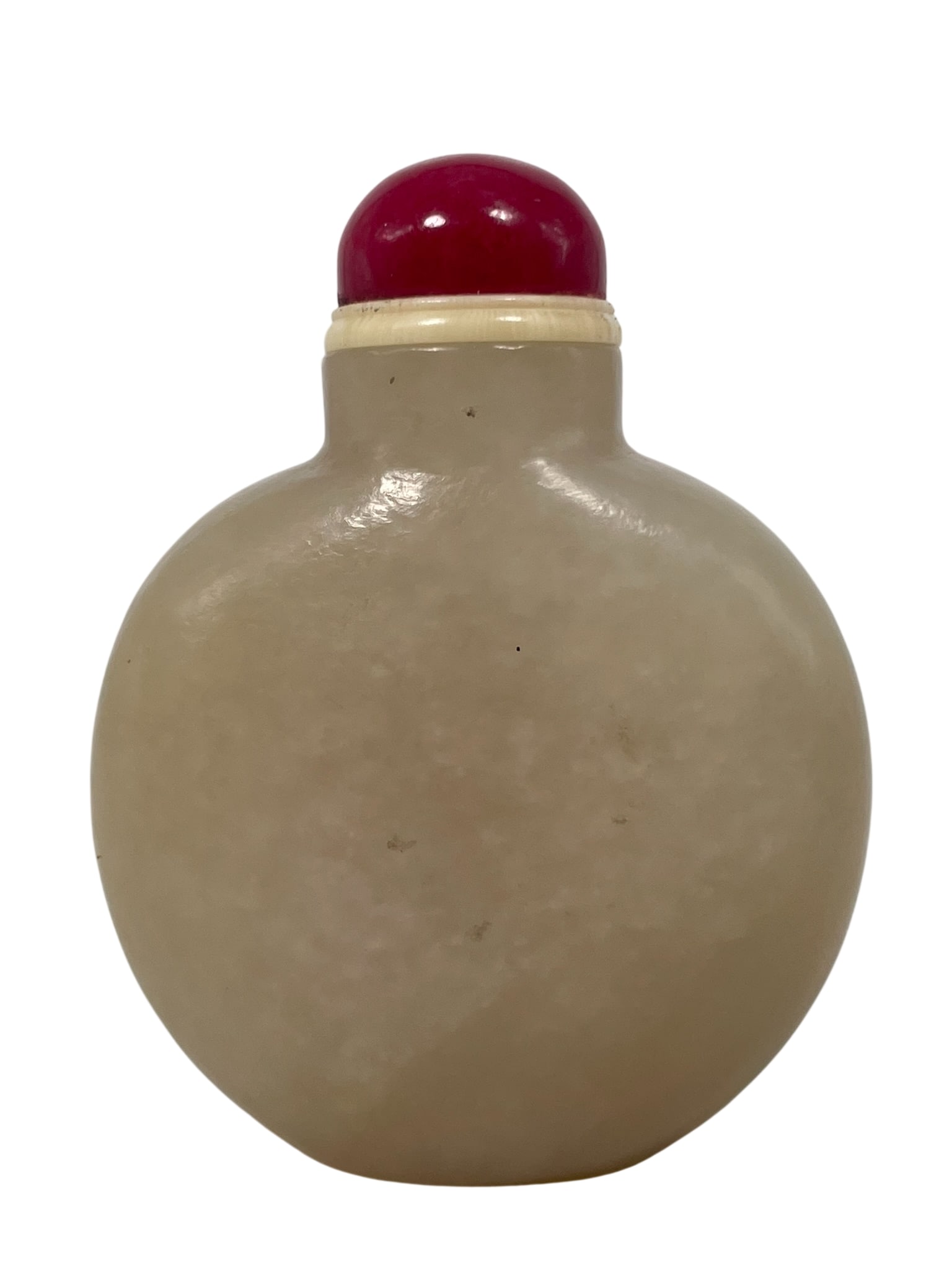 A Chinese White Jade Snuff Bottle: 2.1/2 in. high, 1.7/8 in. wide overall including the stopper.