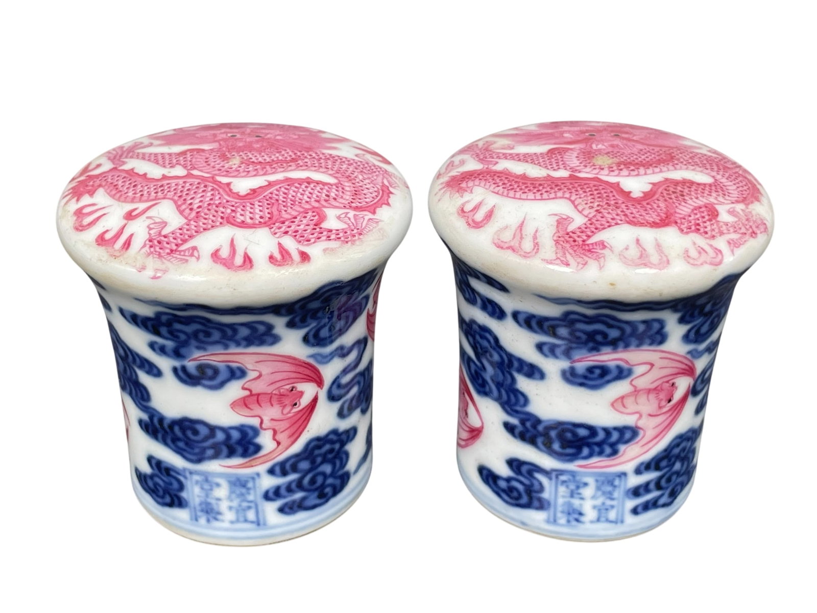 A Pair of Chinese Rouge Enamelled Underglaze-Blue Decorated Covers of Scroll End: 2.1/8 in. high, 2.1/8 in. wide each.