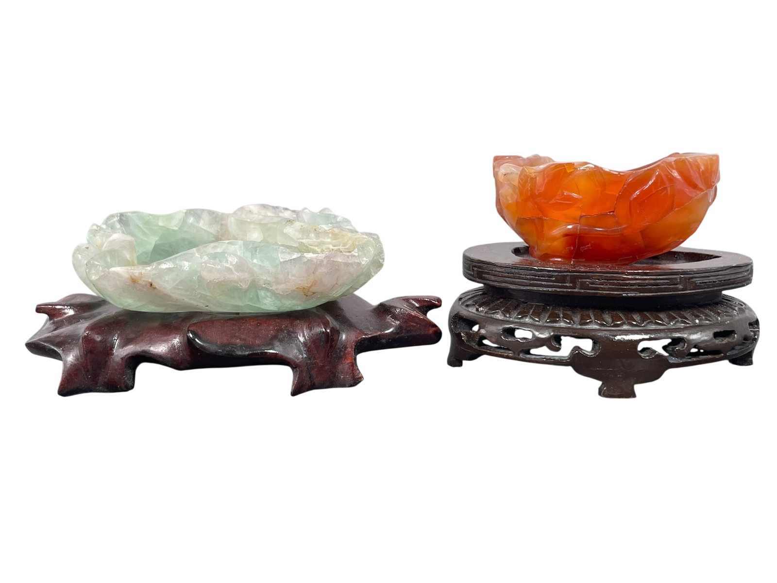 Two Chinese Carved Quartz Brush Washers: Both with wood stands, the red brush washer measures 1.1/2 in. high, 3 in. wide; and the green brush washer measures 1.1/8 in. high, 4.3/4 in. wide.