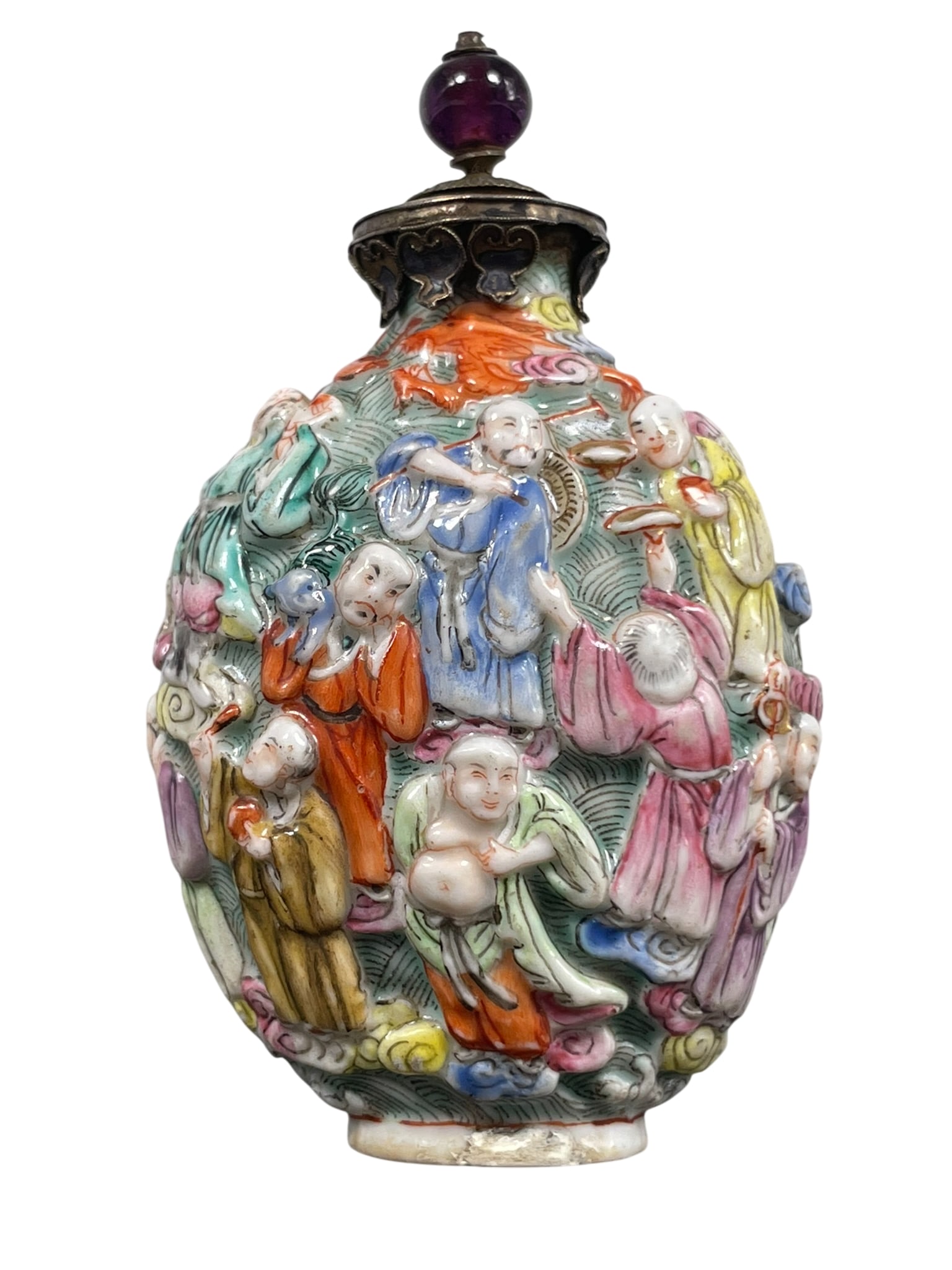 A Chinese Molded Famille Rose 'Luohan' Snuff Bottle: 3.1/4 in. high, 1.7/8 in. wide.
