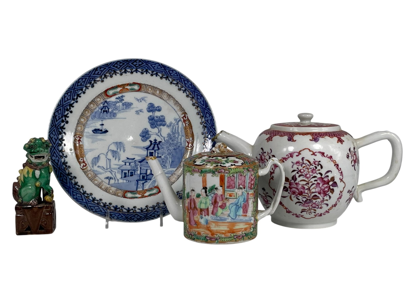 A Group of Four Chinese Porcelain Objects: Comprising an export famille rose teapot and cover, 5.1/2 in. high, 9.1/2 in. wide; a blue and white dish, 8.1/2 in. diam.; a famille rose gilt-decorated teapot and cover, 4.1/4 in. high, 6.1/2 in. wi
