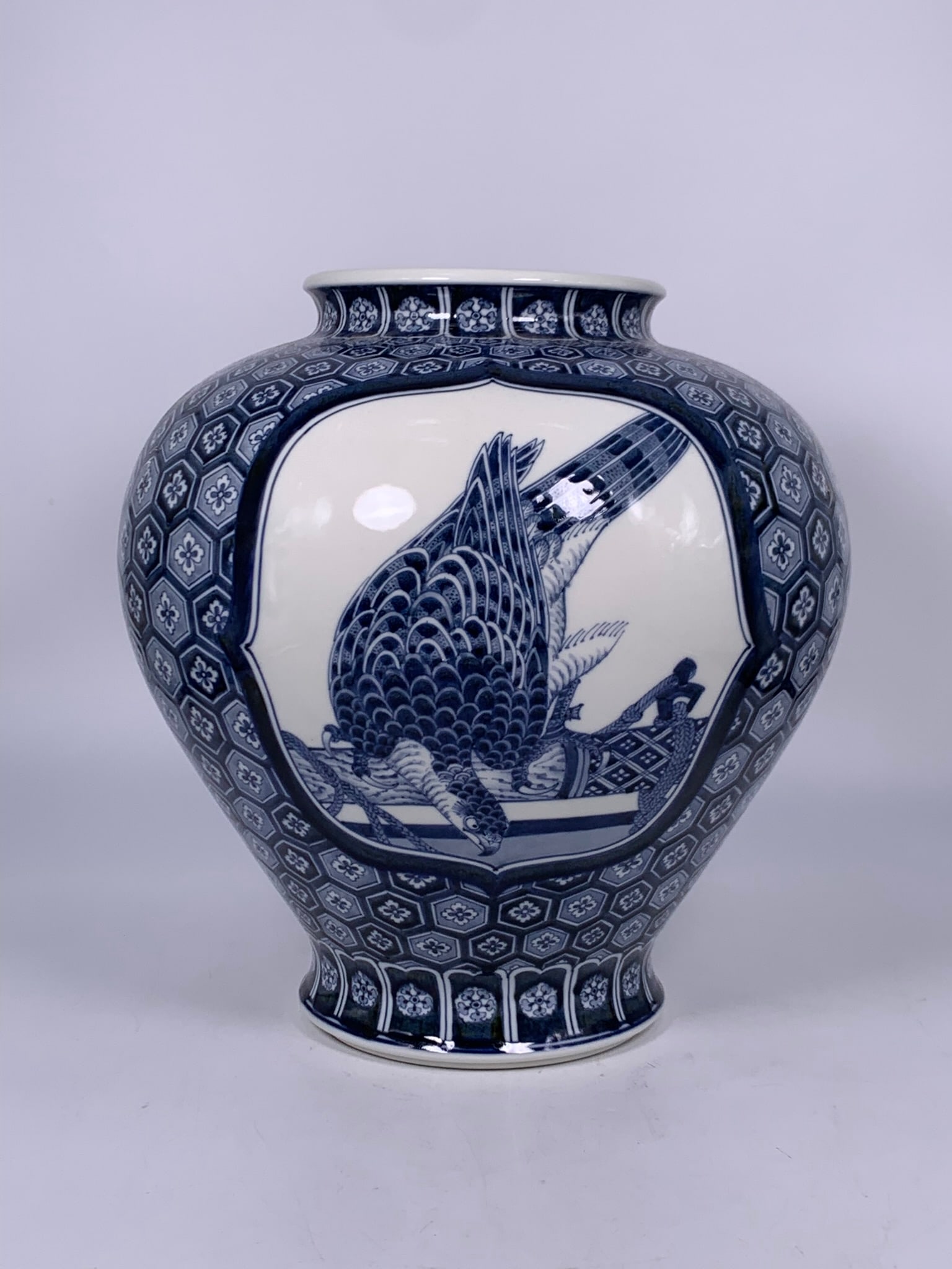 A Japanese Blue and White 'Medallion' 'Hawk' Jar, Koransha Mark: Koransha mark to the bottom. 13.5 in. high, 13 in. wide.