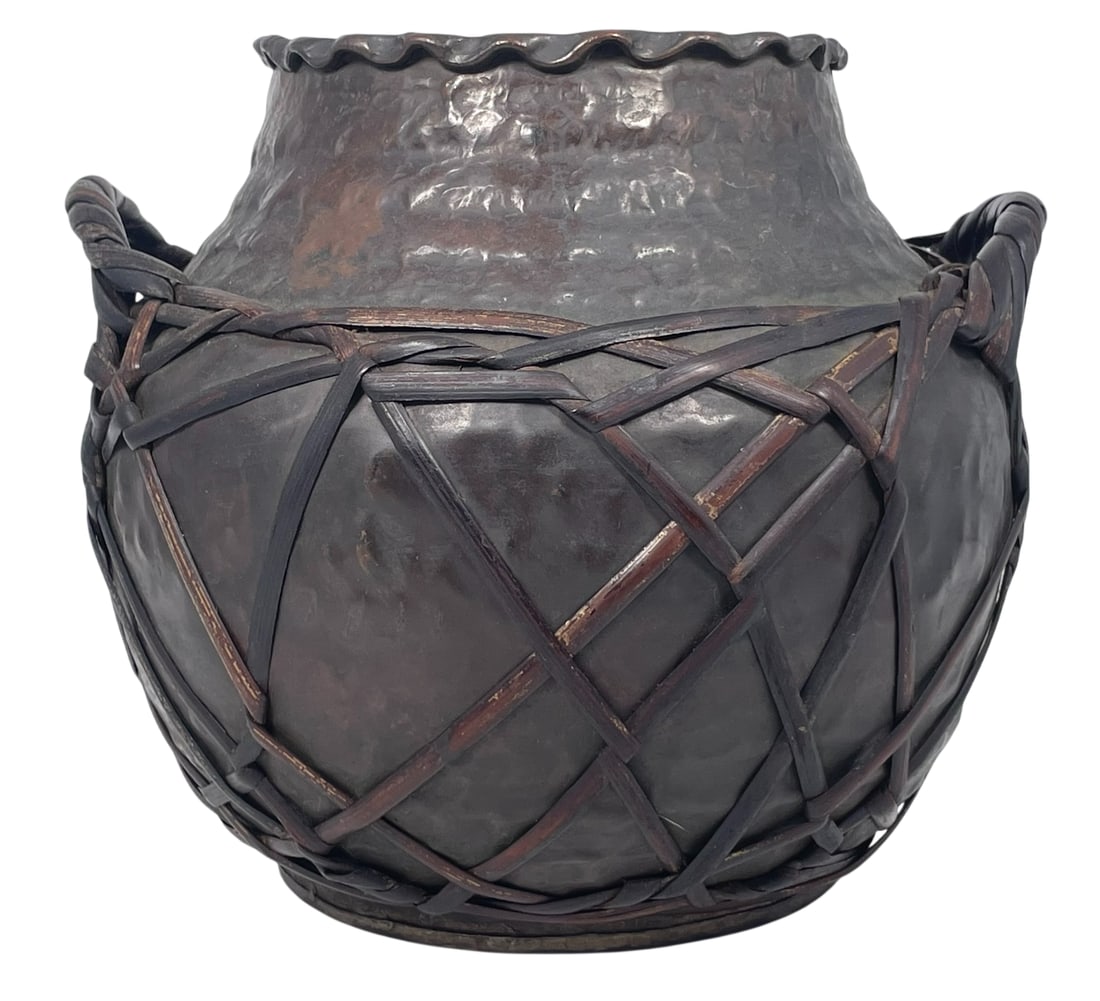 A Japanese Copper Vase Wrapped in Rattan Lattice: 8.1/2 in. high, 10 in. wide.