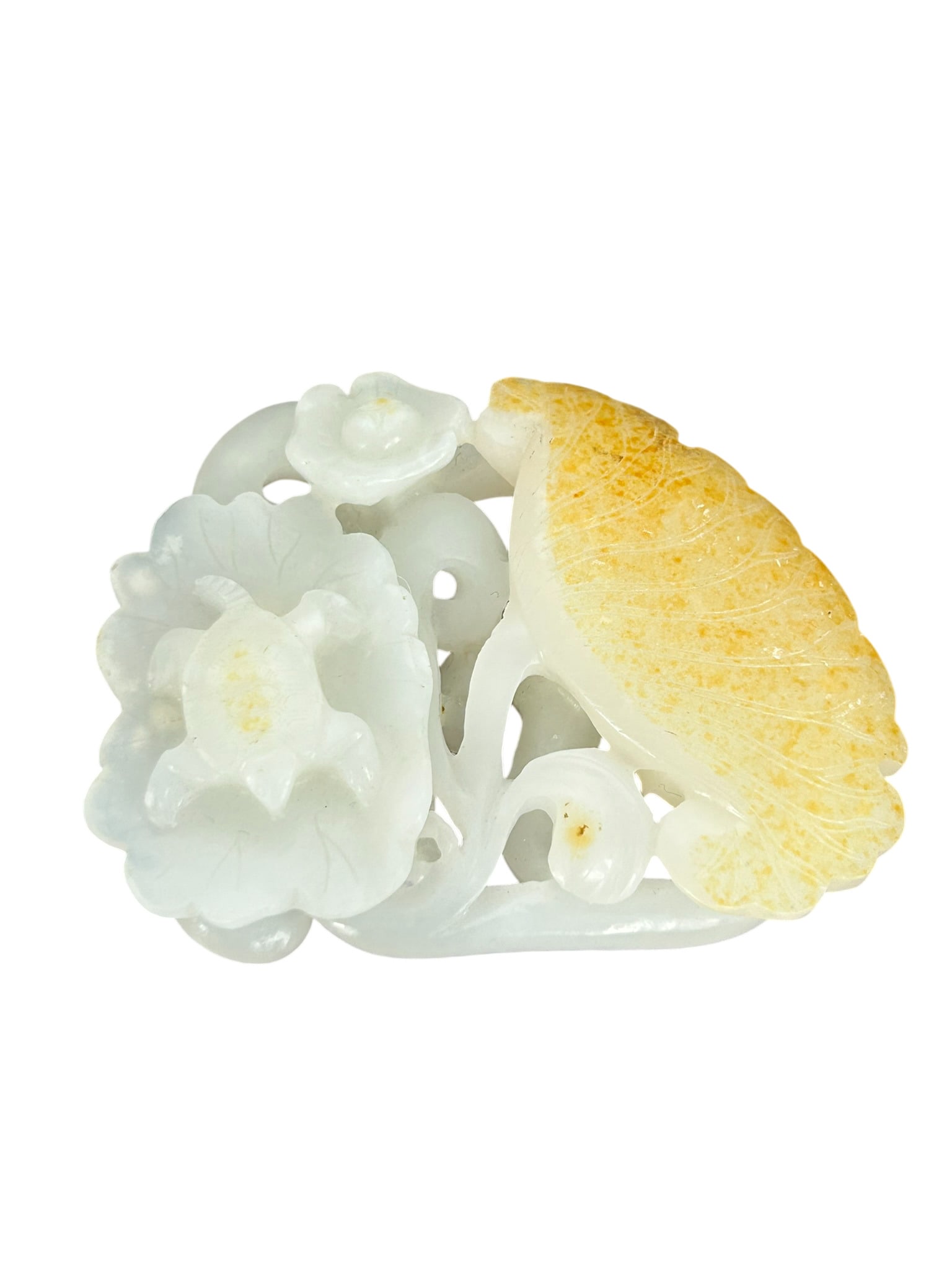 A Chinese White and Russet Carving of a 'Turtle and Lotus' Pendant: 2.3/4 in. long, 2.1/4 in. wide.