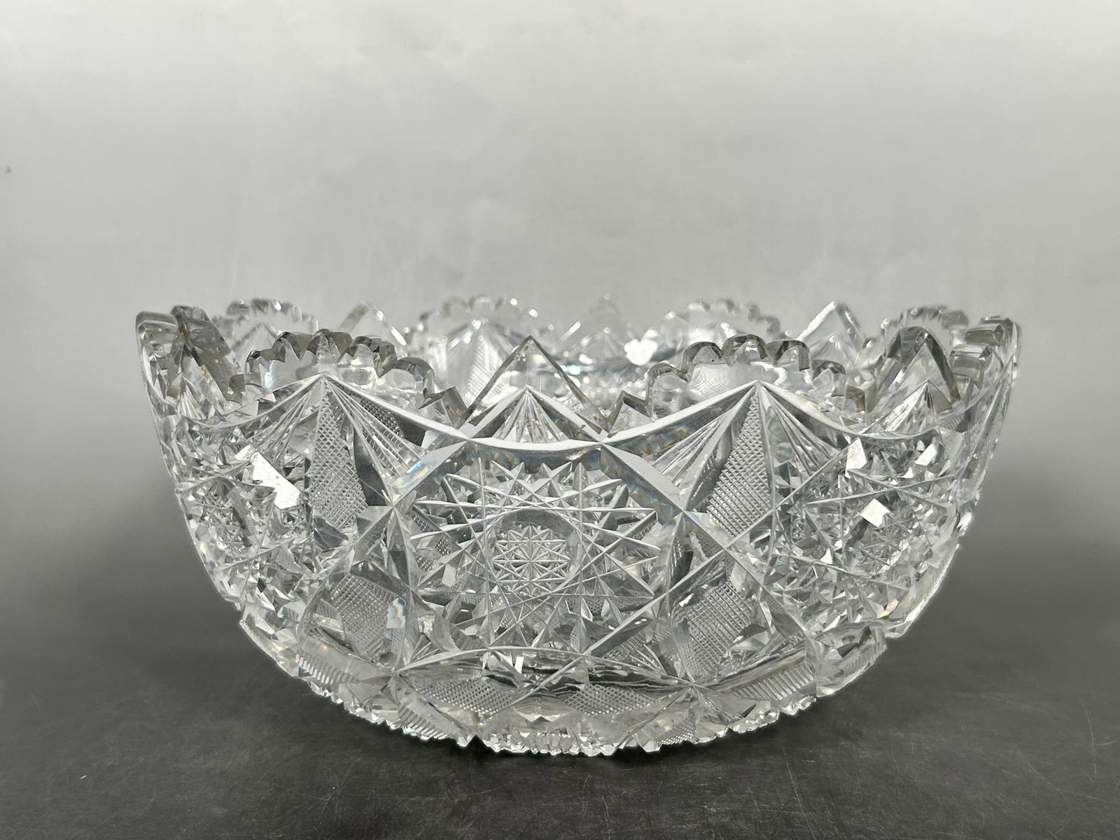 An American Brilliant Cut Crystal Bowl with Sawtooth Edge: 4.3/4 in. high, 10 in. diam.