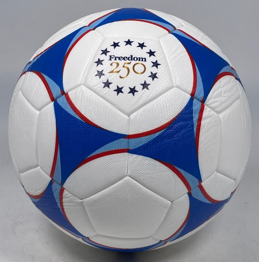A Rare Collectible 'United States Mission, China' United States' 250th Anniversary Soccer Ball: The soccer ball featuring the Great Seal of the United States (the American bald eagle holding an olive branch and arrows, with a shield on its chest) surrounded by the text "UNITED STATES MISSION" on